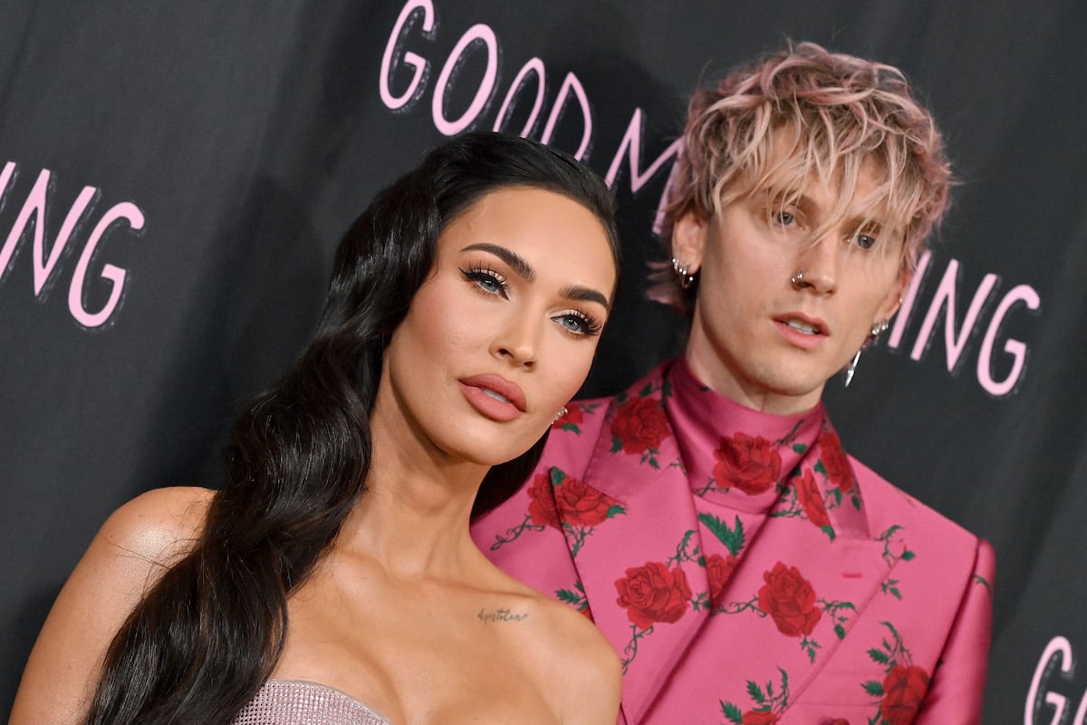 Megan Fox and Machine Gun Kelly pose together at an event.