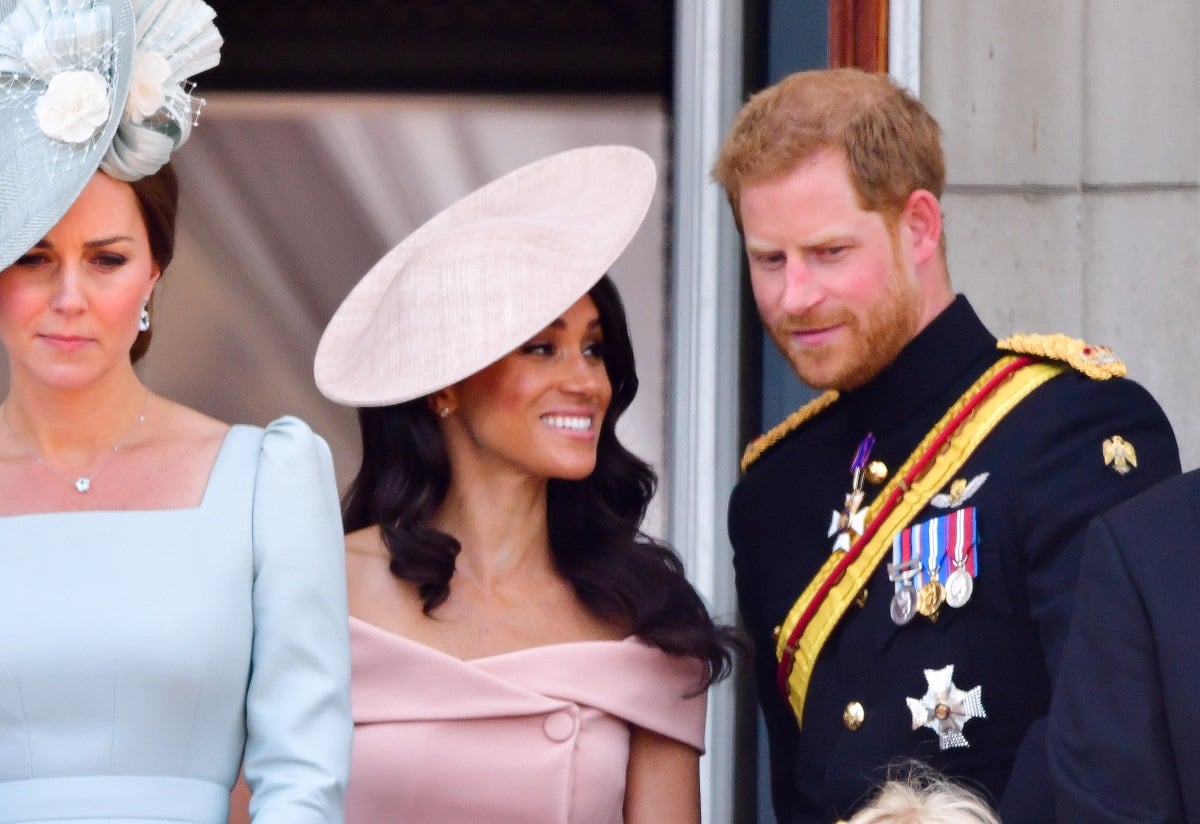 Meghan Markle and Prince Harry standing on the balcony of Buckingham Palace during 2018 Trooping the Colour