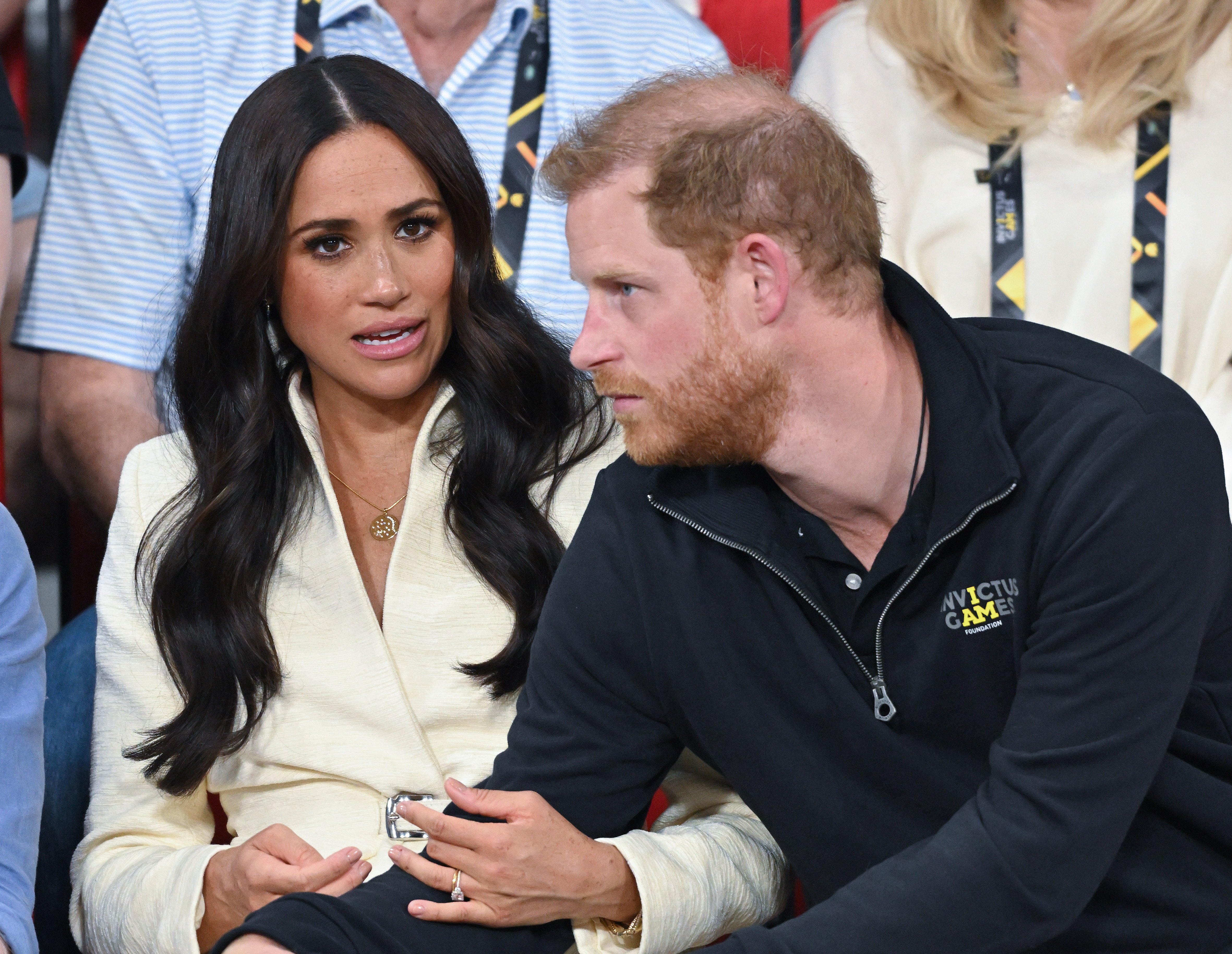 Meghan Markle speaking with Prince Harry at the Invictus Games sitting volleyball event