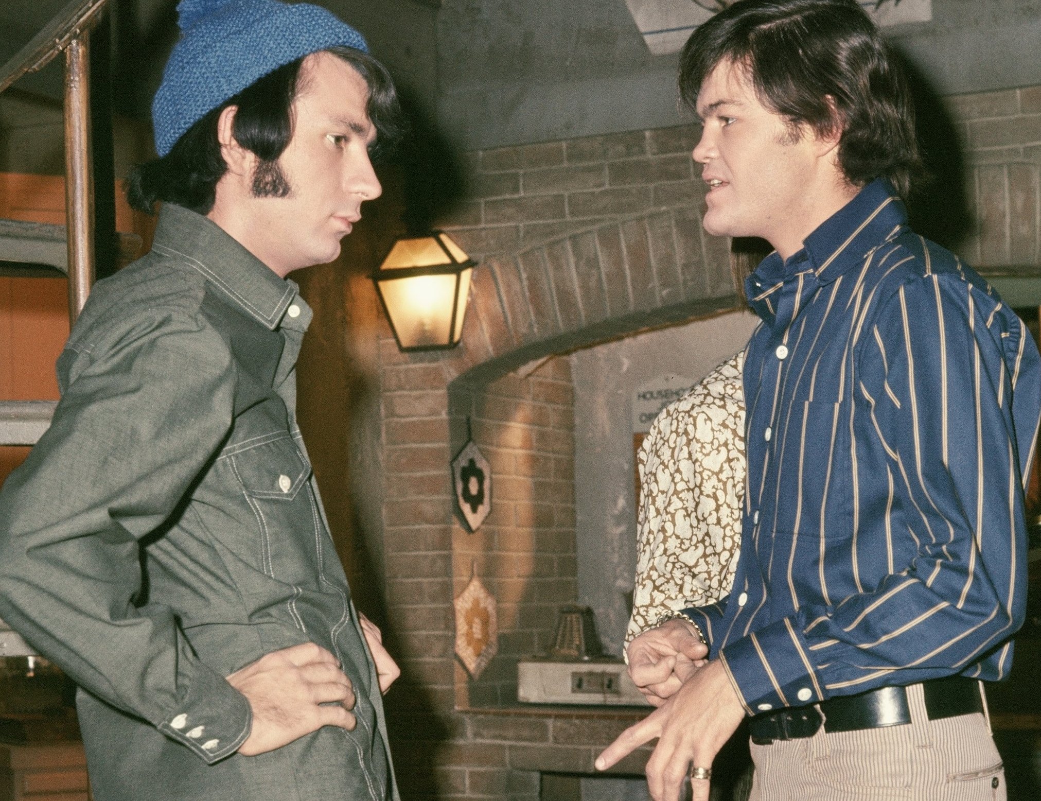 The Monkees' Mike Nesmith and Micky Dolenz near stairs