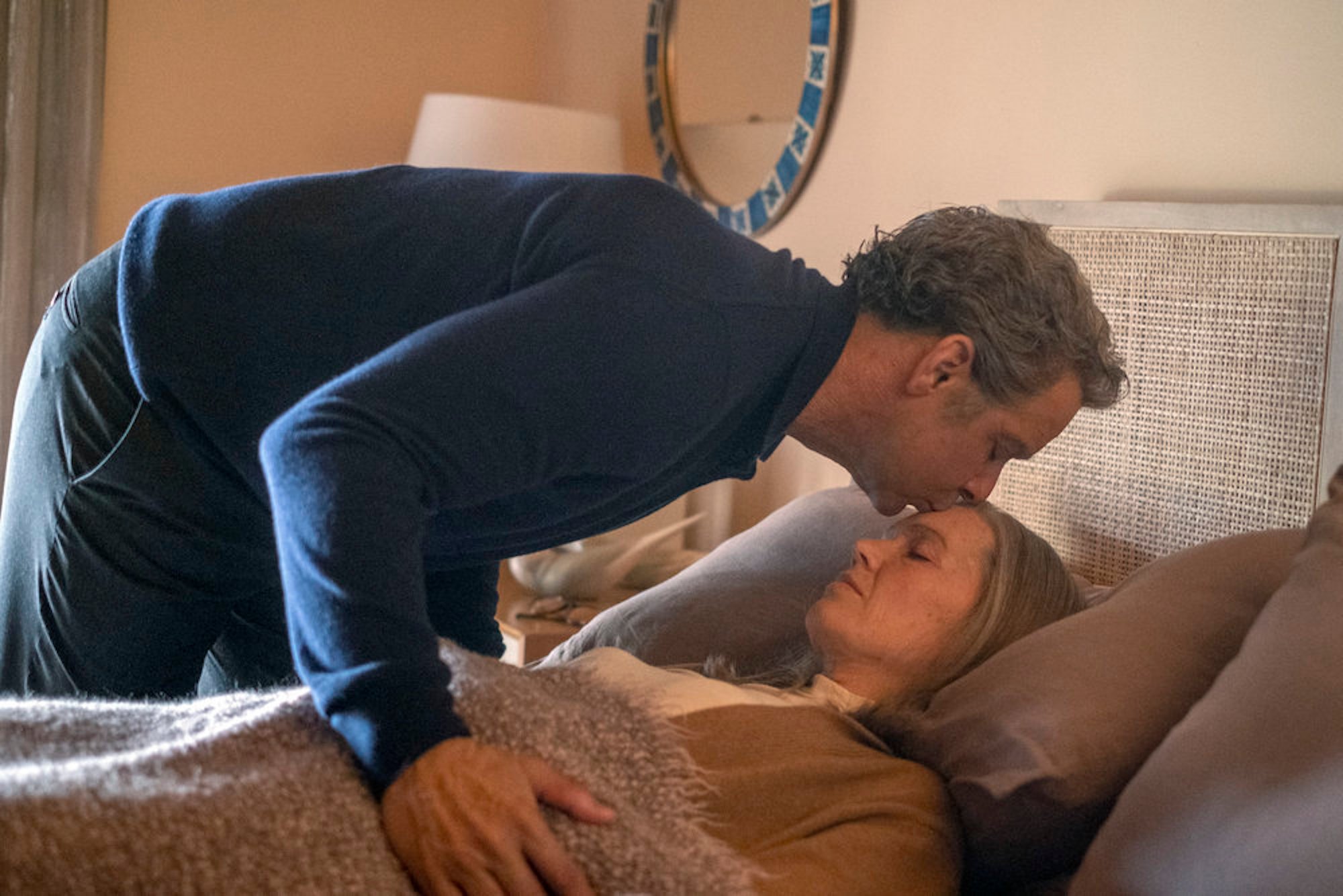 Miguel kissing Rebecca's forehead as she lies in bed in 'This Is Us' Season 6 Episode 15