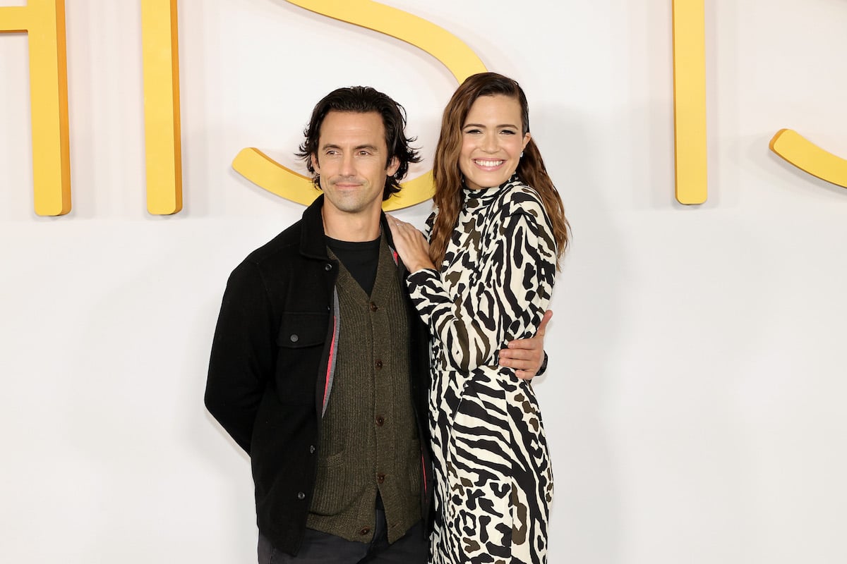 Milo Ventimiglia and Mandy Moore, who eat lunch on the 'This Is Us' set, smile as they pose on a red carpet