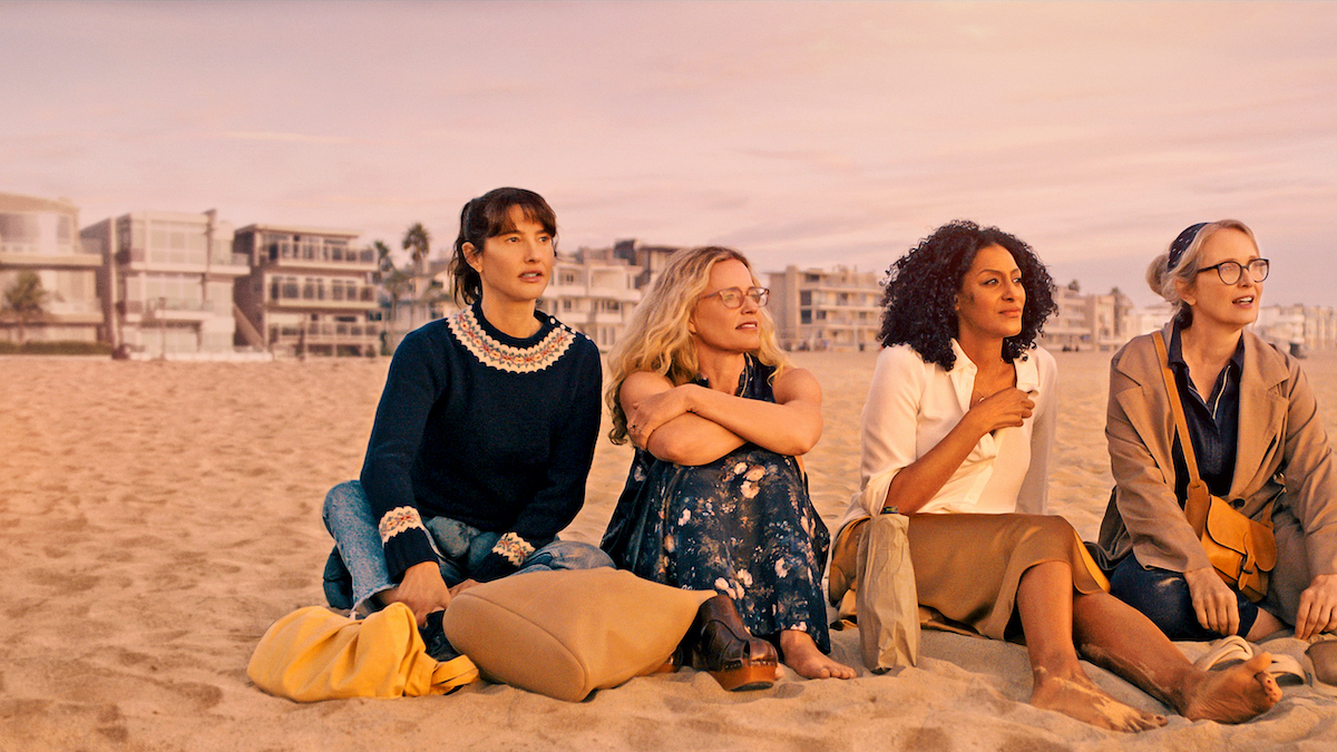 Four women sitting on beach in Netflix's canceled series 'On the Verge'