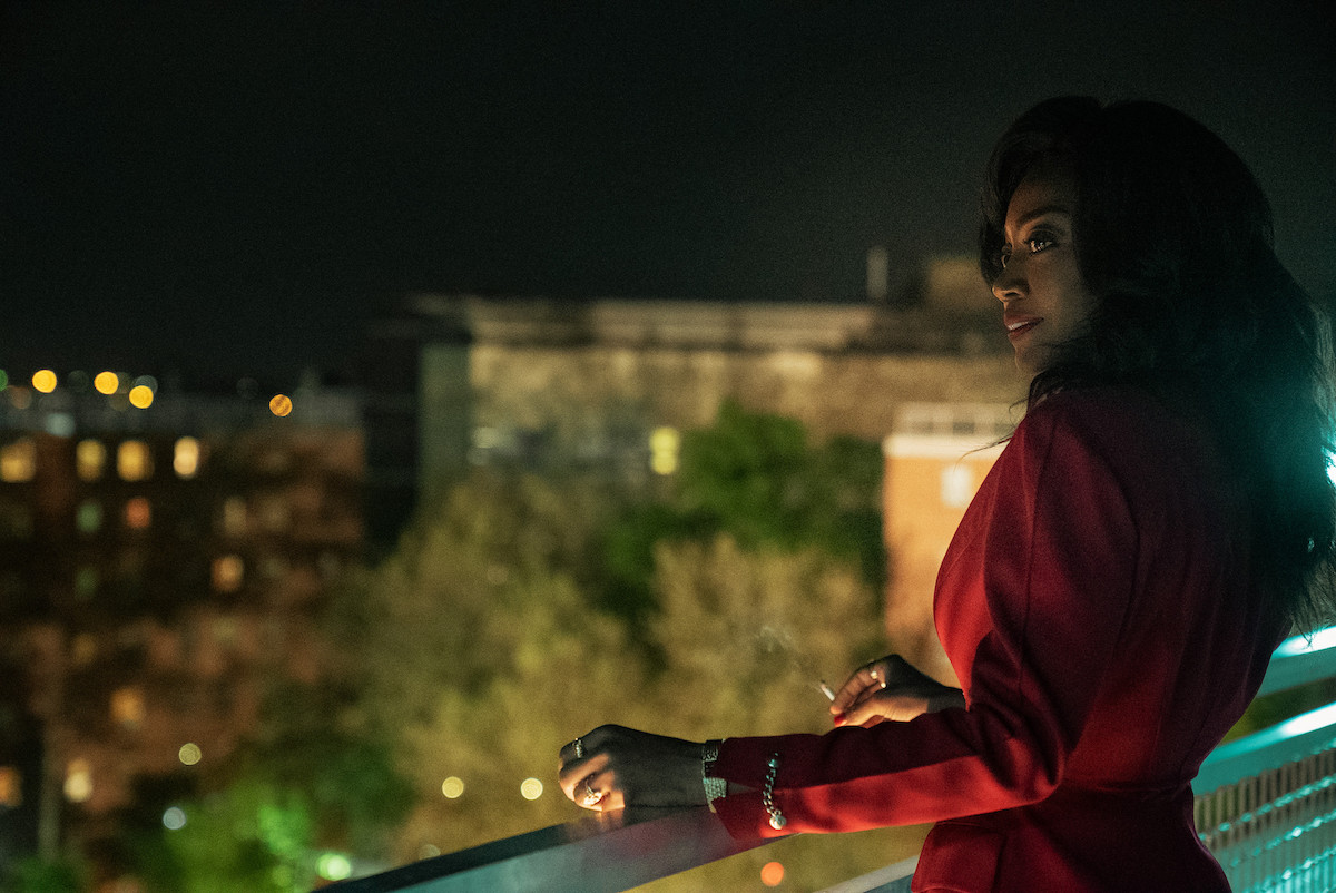 Patina Miller as Raquel 'Raq' Thomas. She has on a red suit as she looks over a balcony in a scene in 'Power Book III: Raising Kanan'