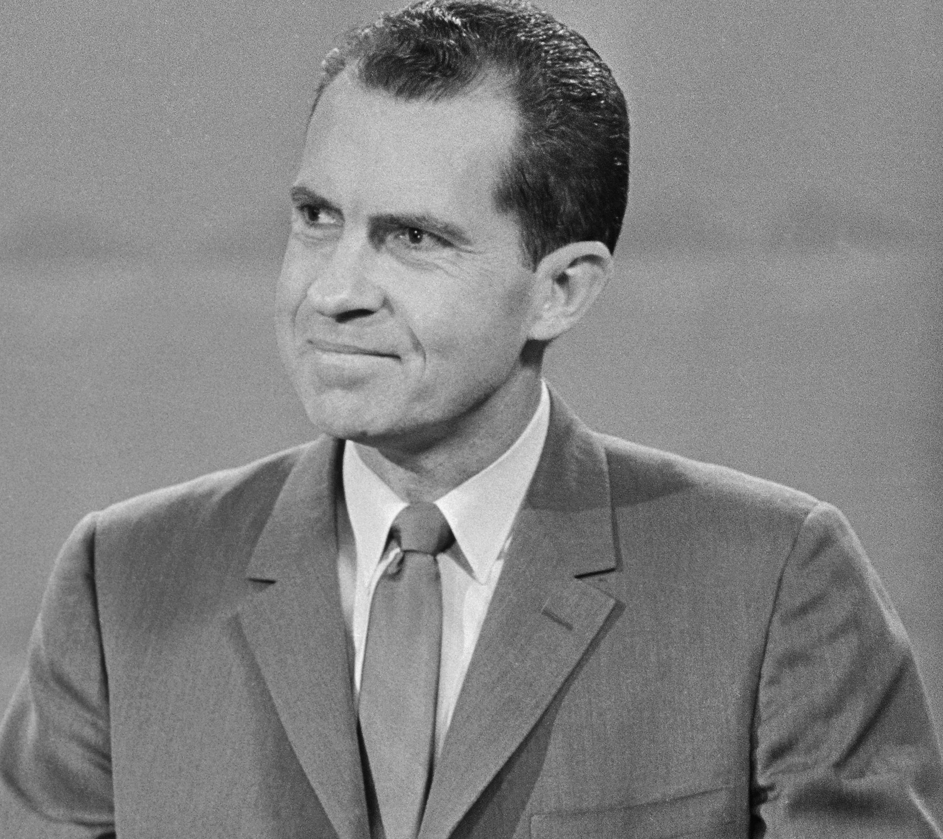 President Richard Nixon wearing a suit and tie