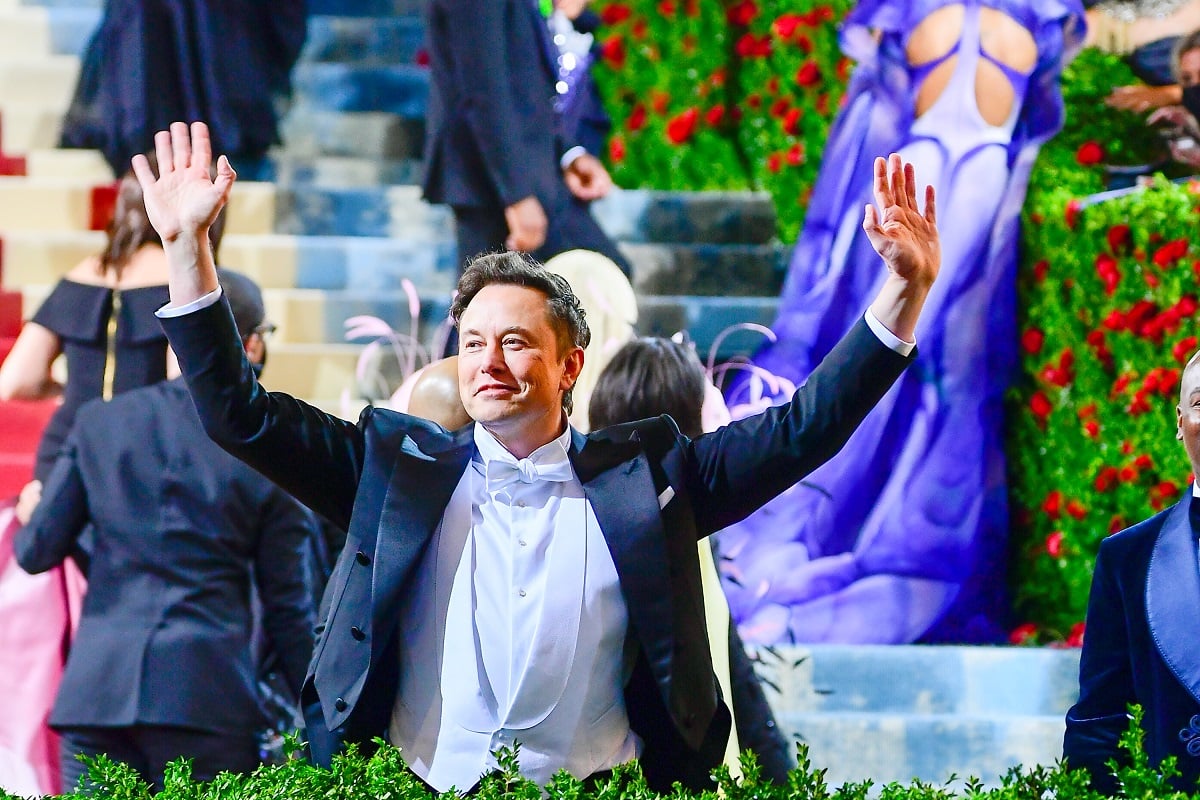 Elon Musk, who owns a Bay Area events house, with his hands in the air at the 2022 Met Gala