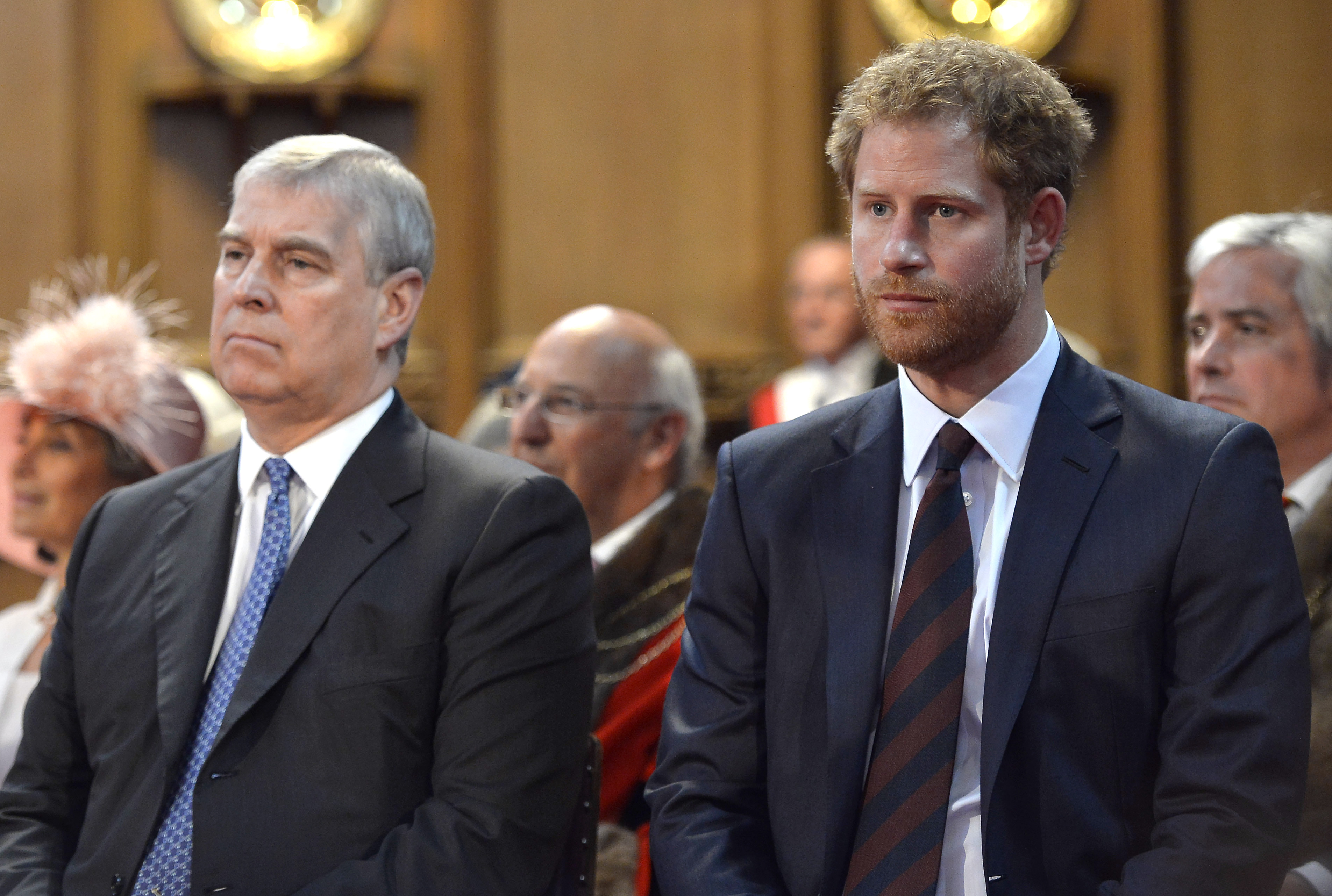 Prince Andrew and Prince Harry seated next to each other during a reception fro Queen Elizabeth II's birthday