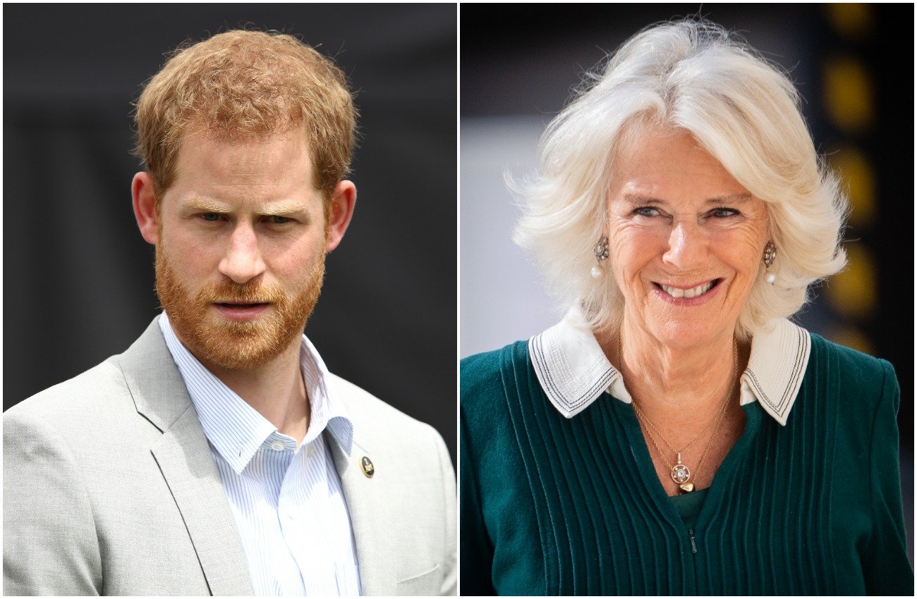 Prince Harry wearing a gray suit and looking on towards the camera. Camilla Parker Bowles wearing a dark green outfit and smiling