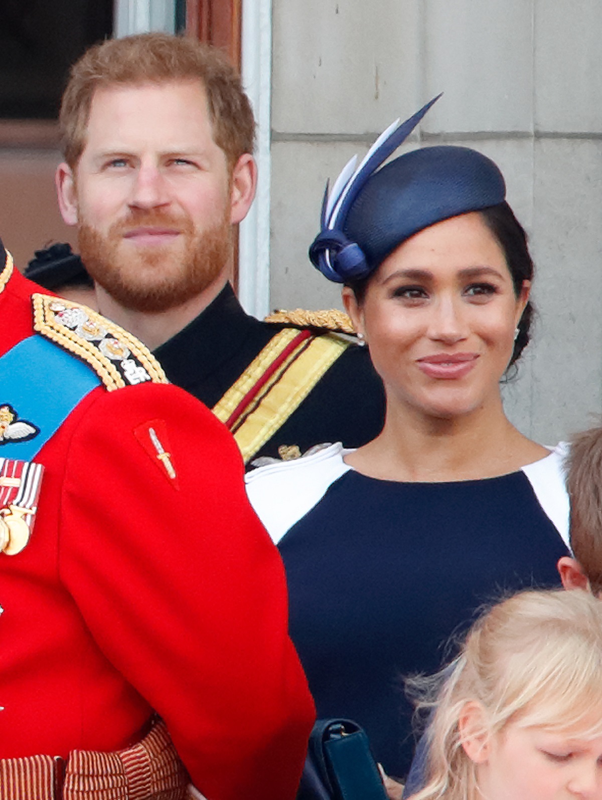 Prince Harry and Meghan Markle watch a flypast from the balcony during 2019 Trooping The Colour