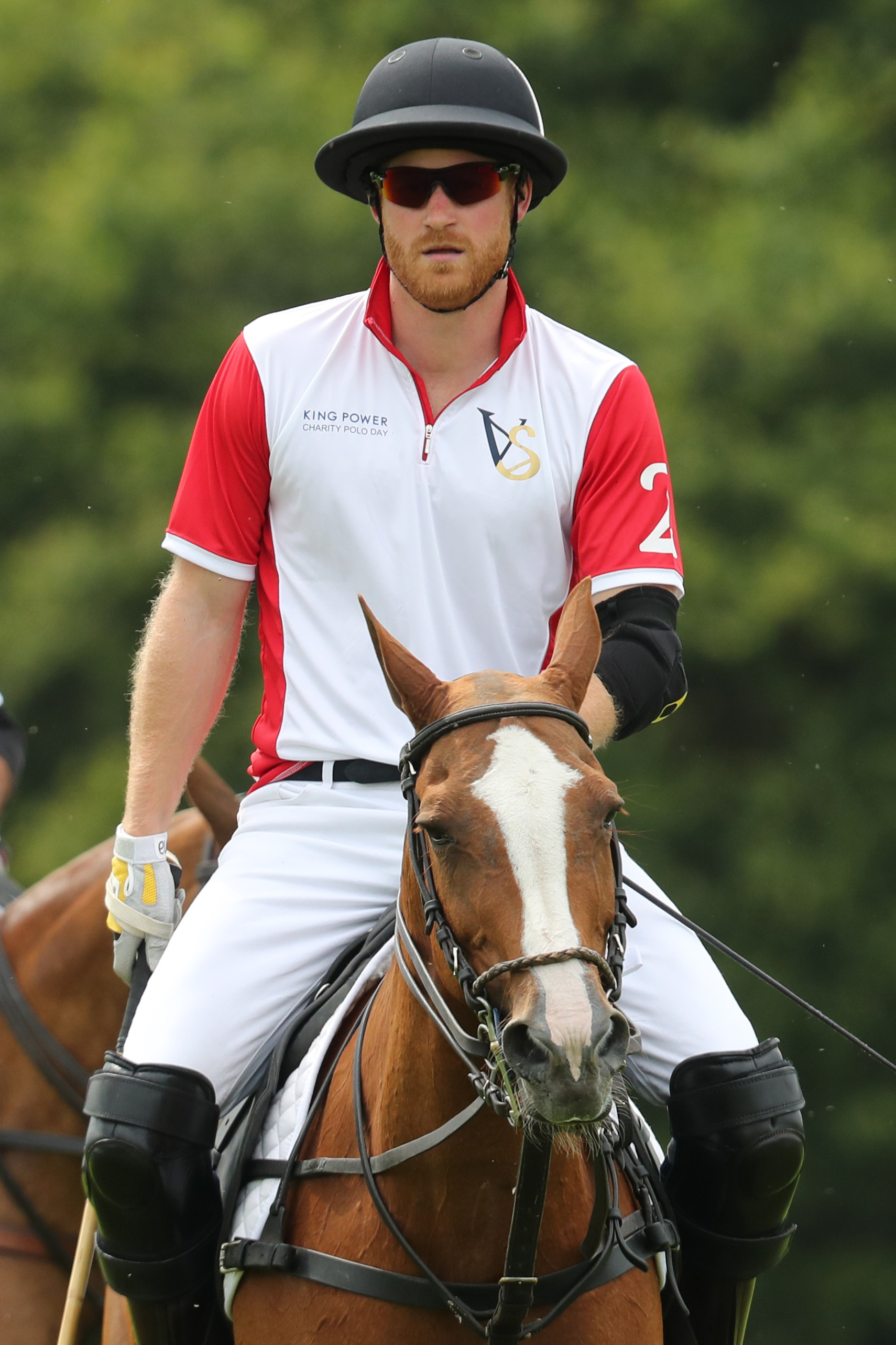 Prince Harry competing during King Power Royal Charity Polo Day