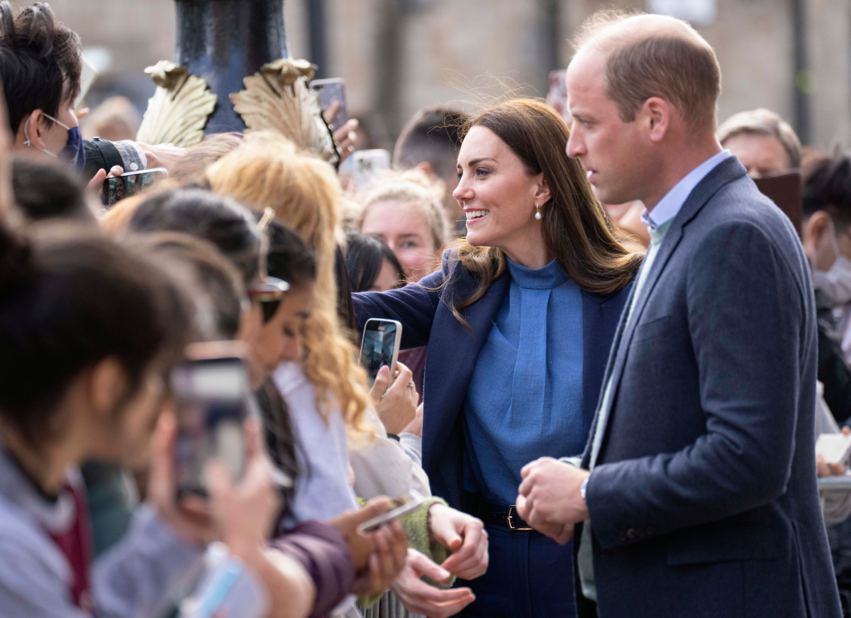 Prince William and Kate Middleton greet fans on a walkabout after a visit to the University of Glasgow to talk with students about mental health and wellbeing on May 11, 2022 in Glasgow, Scotland
