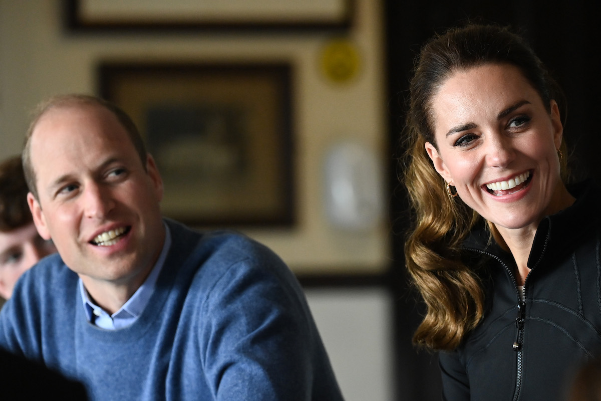 Prince William and Kate Middleton, who did a podcast interview on 'Happy Mum, Happy Baby,' smile as they look on