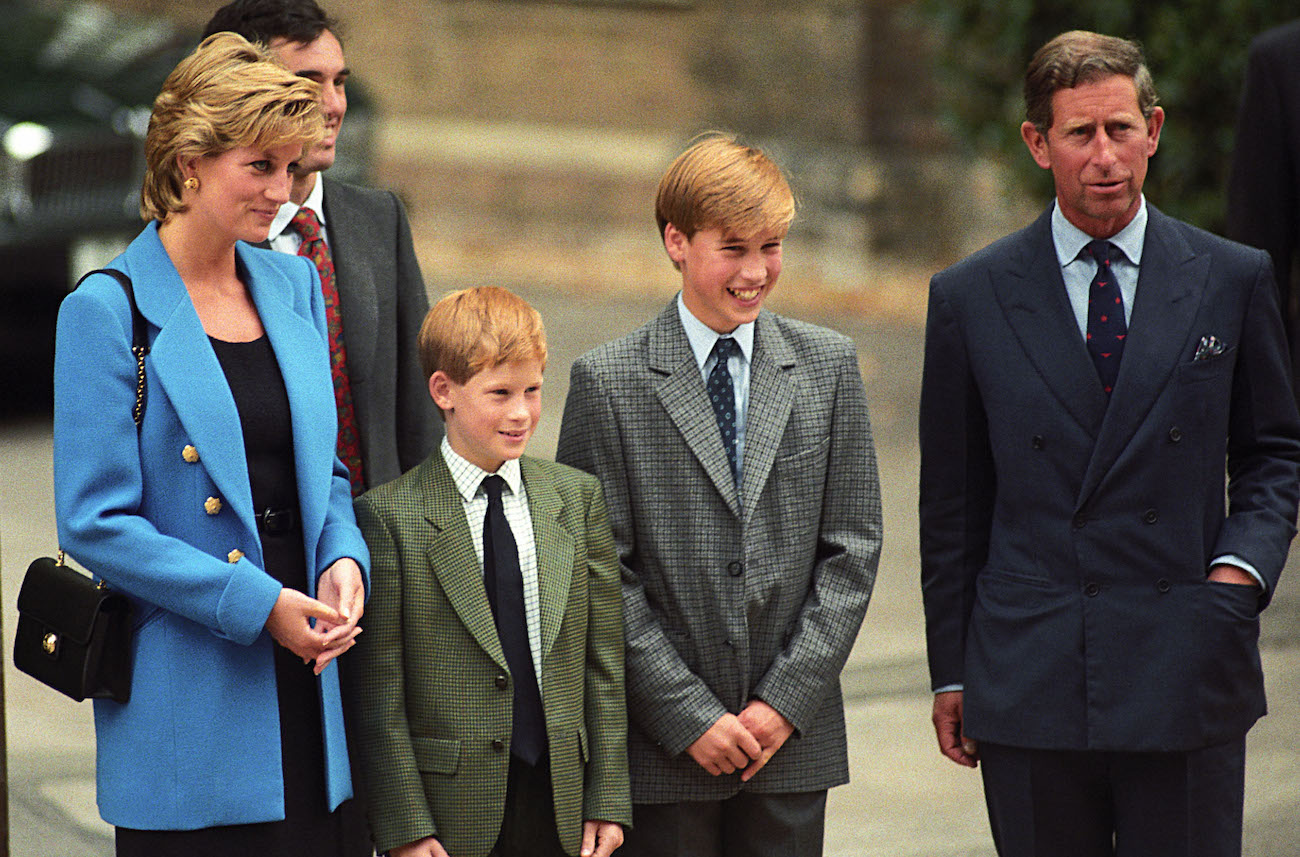 Princess Diana and Prince Charles standing with young Prince Harry and Prince William