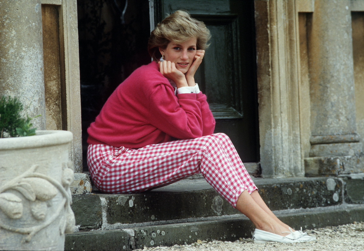 Princess Diana sitting on stone steps