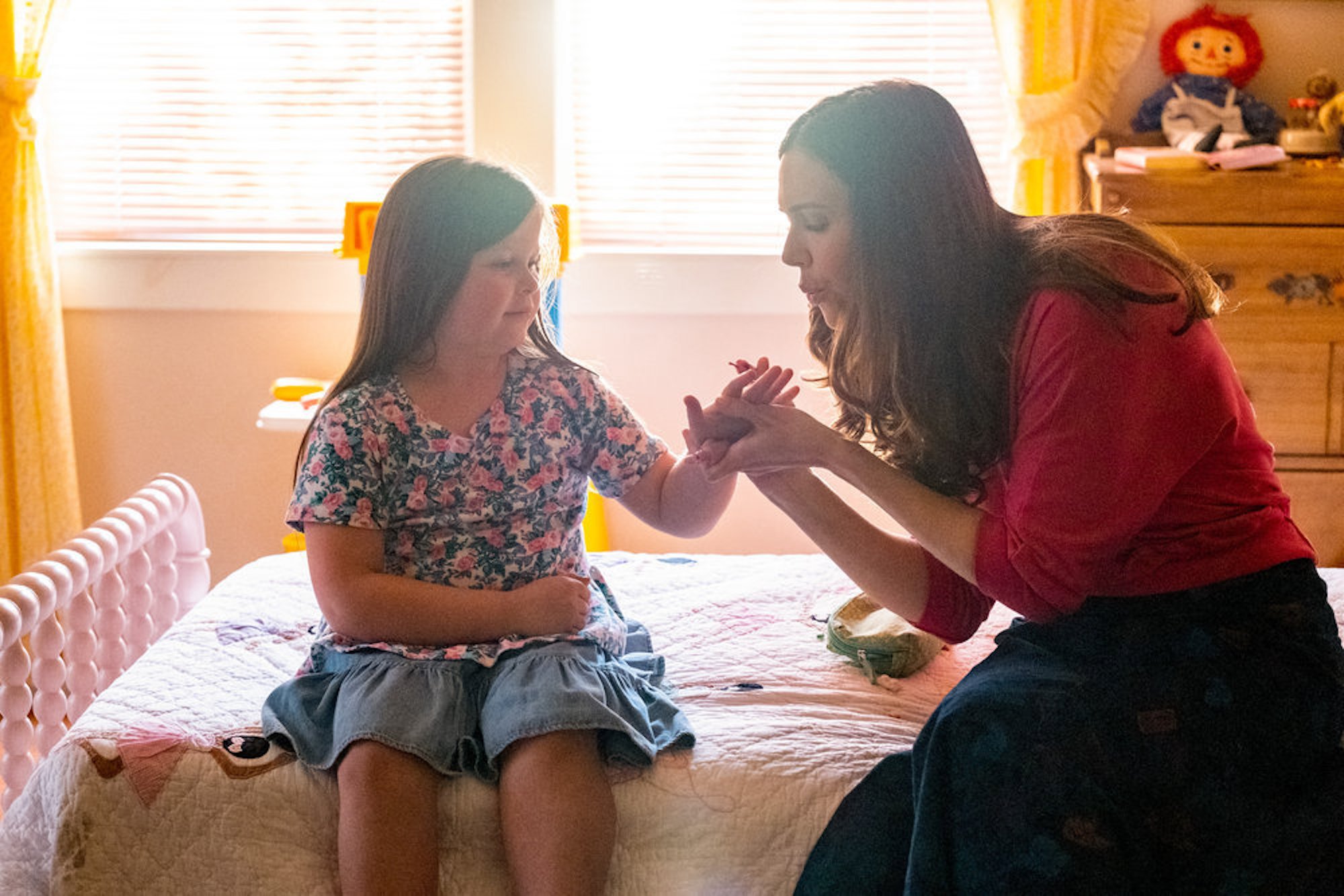 Rebecca blowing on the nails of a young Kate in 'This Is Us' Season 6 Episode 16