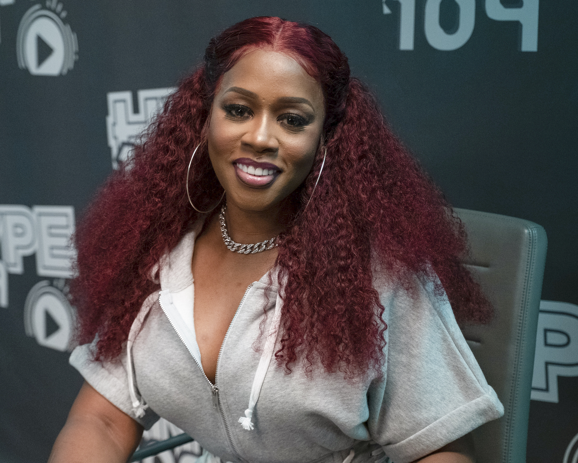 Remy Ma wearing red hair