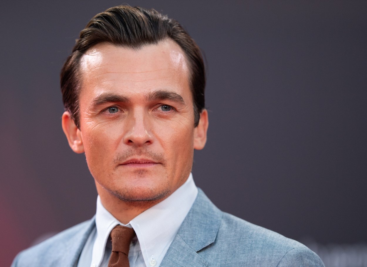 Rupert Friend attends the 'The French Dispatch' in London in 2021. Friend's net worth could grow thanks to 'Obi-Wan Kenobi' and roles in two upcoming Wes Anderson movies.
