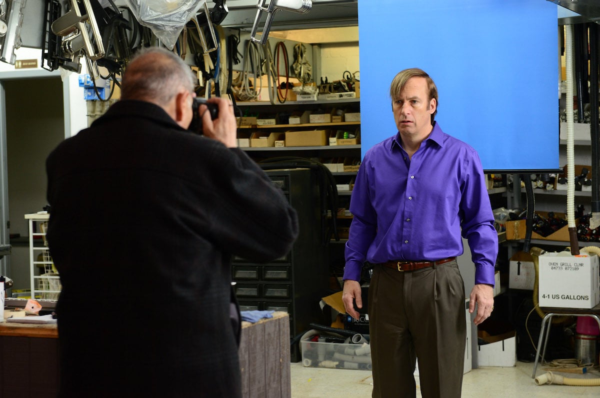 Bob Odenkirk as his 'Better Call Saul' character Saul Goodman getting his picture taken by Ed the Disappearer in 'Breaking Bad'
