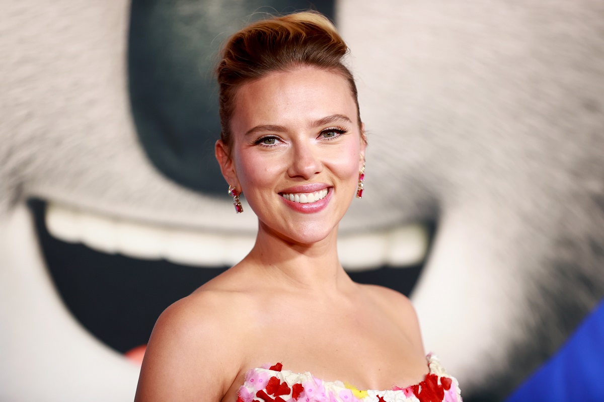 Scarlett Johansson smiling while wearing a dress.