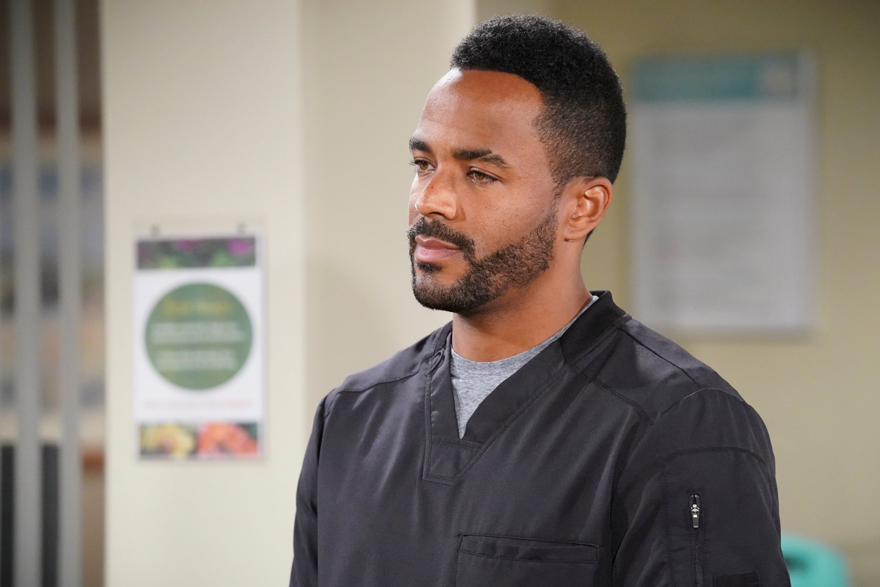 'The Young and the Restless' actor Sean Dominic wearing grey scrubs during a hospital scene.