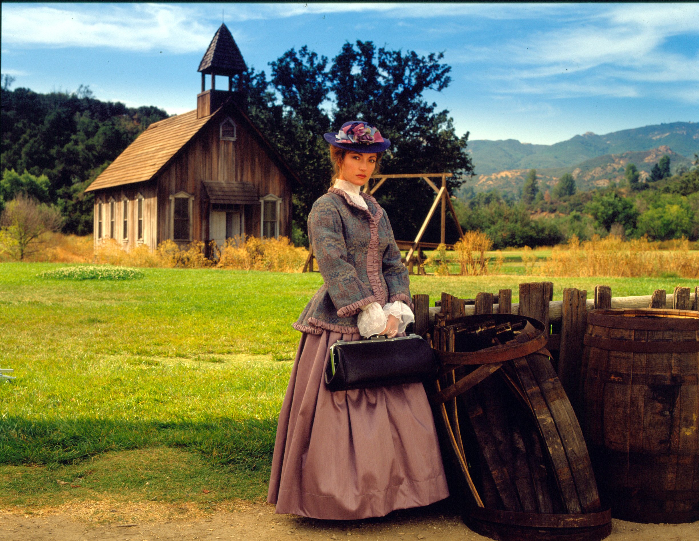 Jane Seymour standing in front of a church in 'Dr. Quinn, Medicine Woman,' one of several shows like 'Call the Midwife'