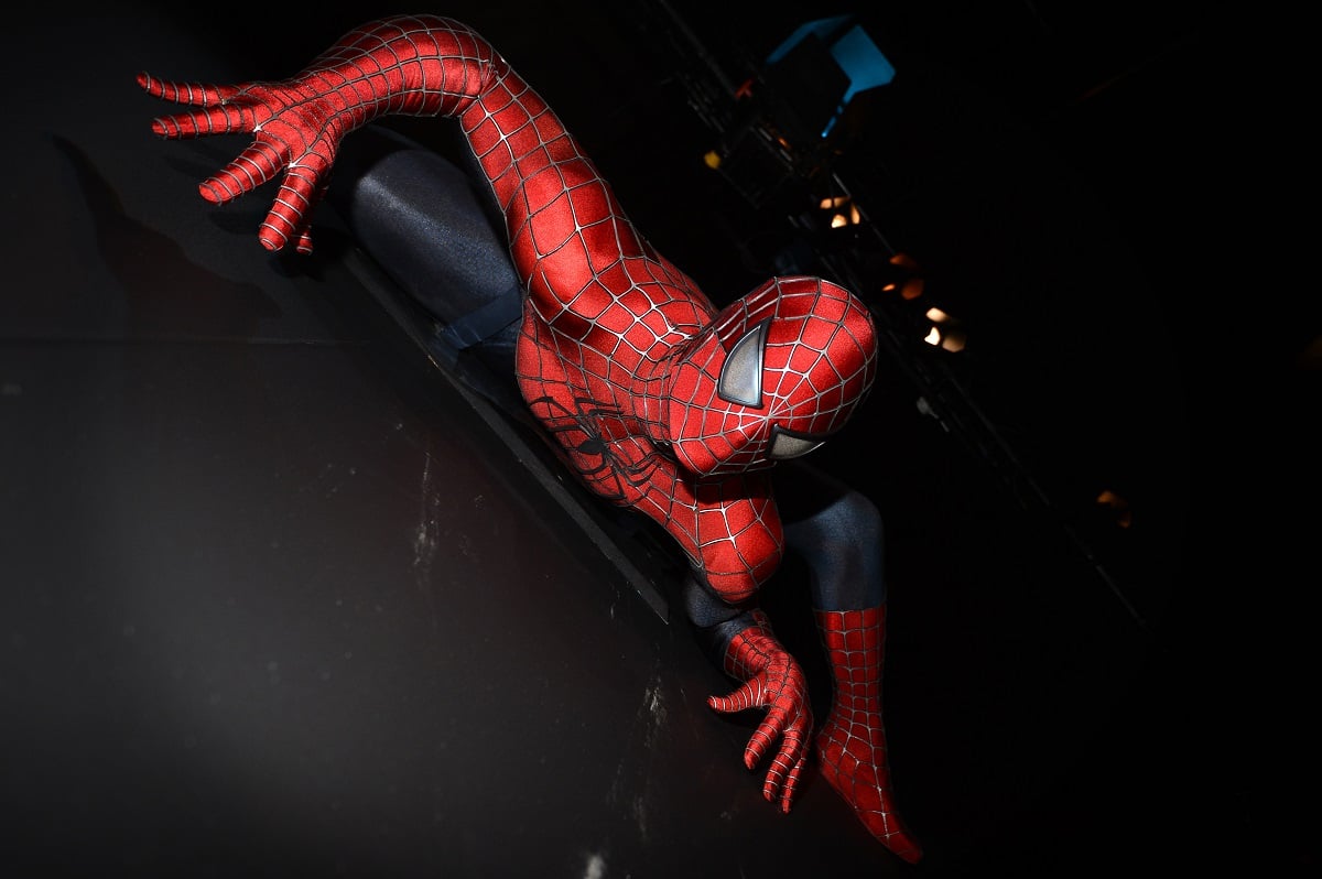Spider-Man climbing a building.