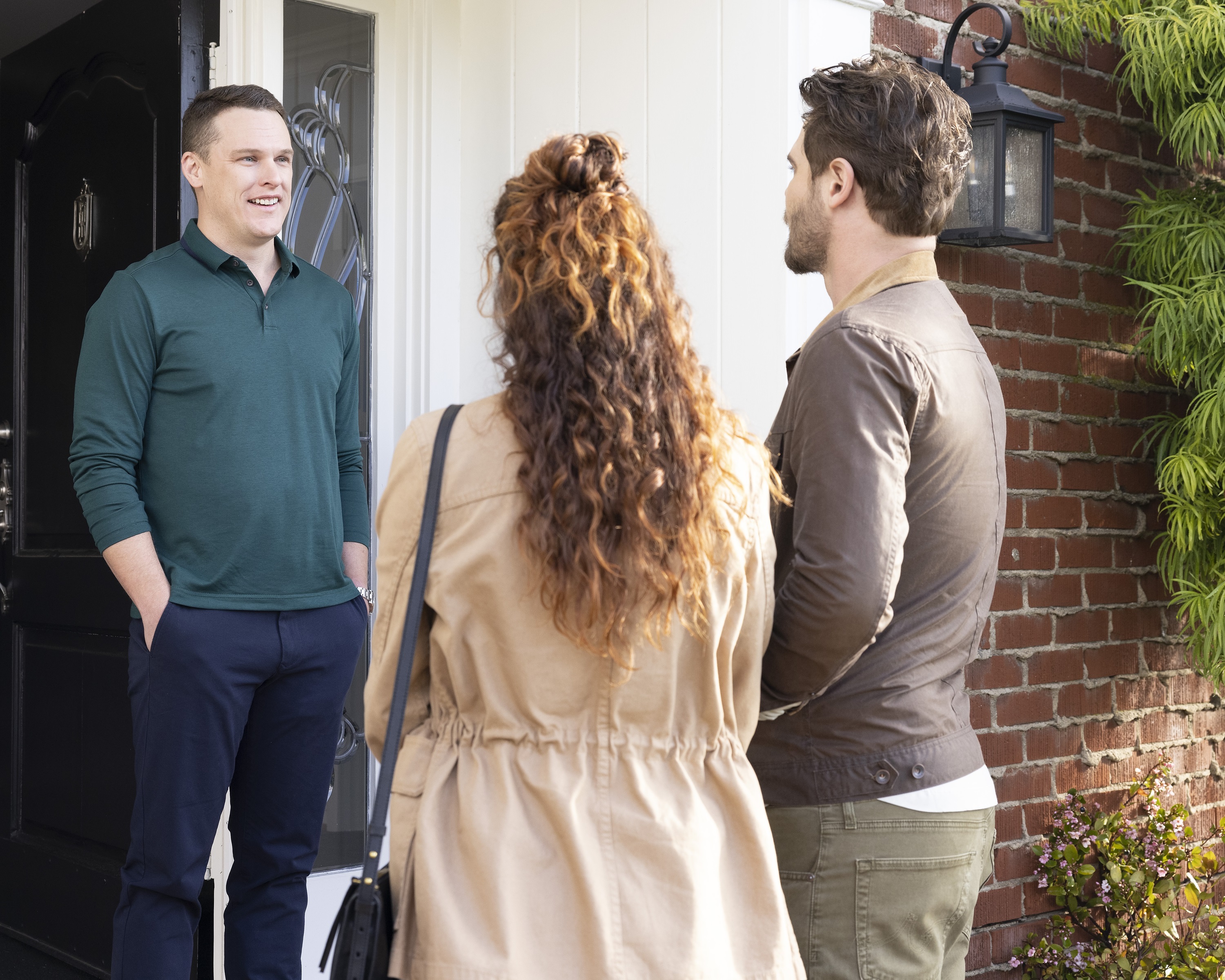 'Station 19': Grant Harvey, Jaina Lee Ortiz and Grey Damon talking together at a front door