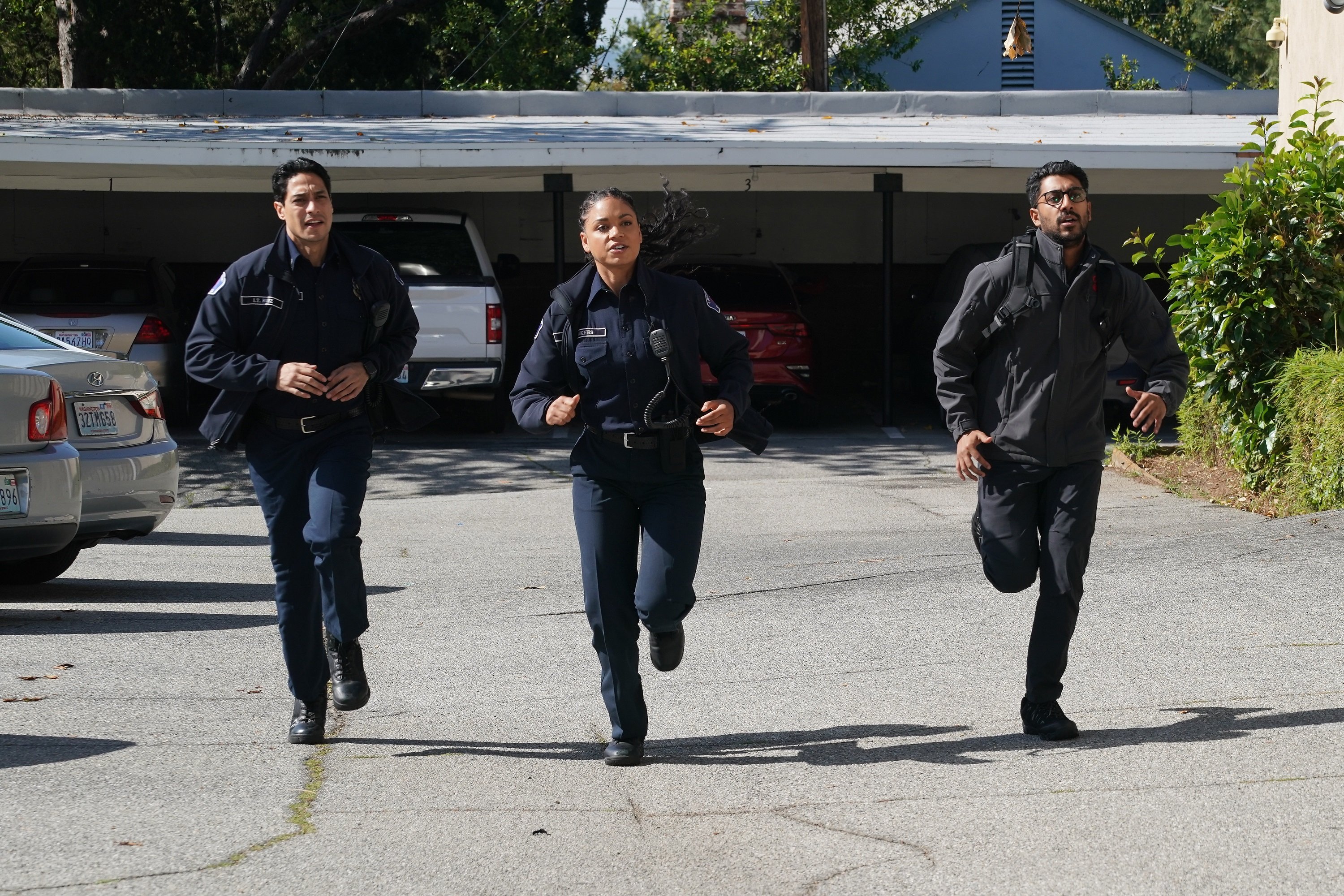 'Station 19' cast members Carlos Miranda and Barrett Doss running with Ritesh Rajan