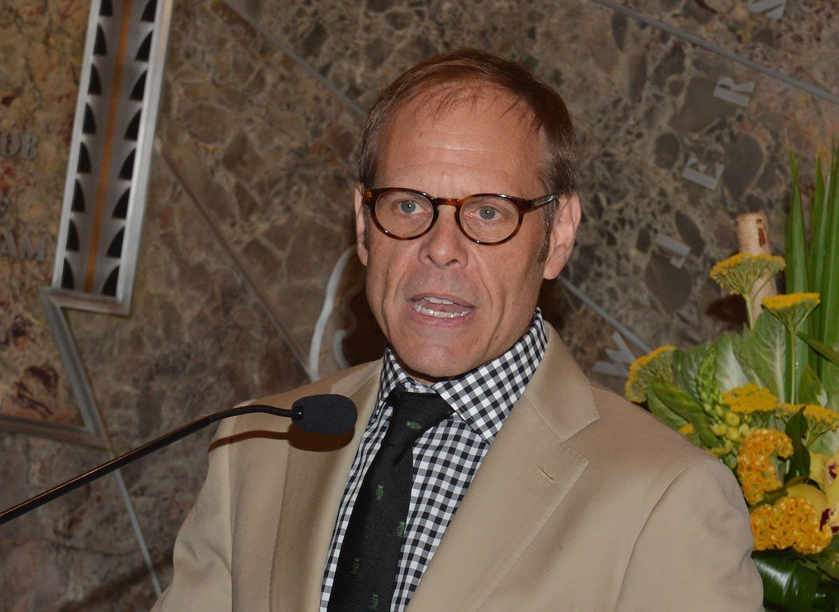 Celebrity chef Alton Brown attends a celebration of the James Beard Foundation in a khaki suit and checkered shirt in 2012