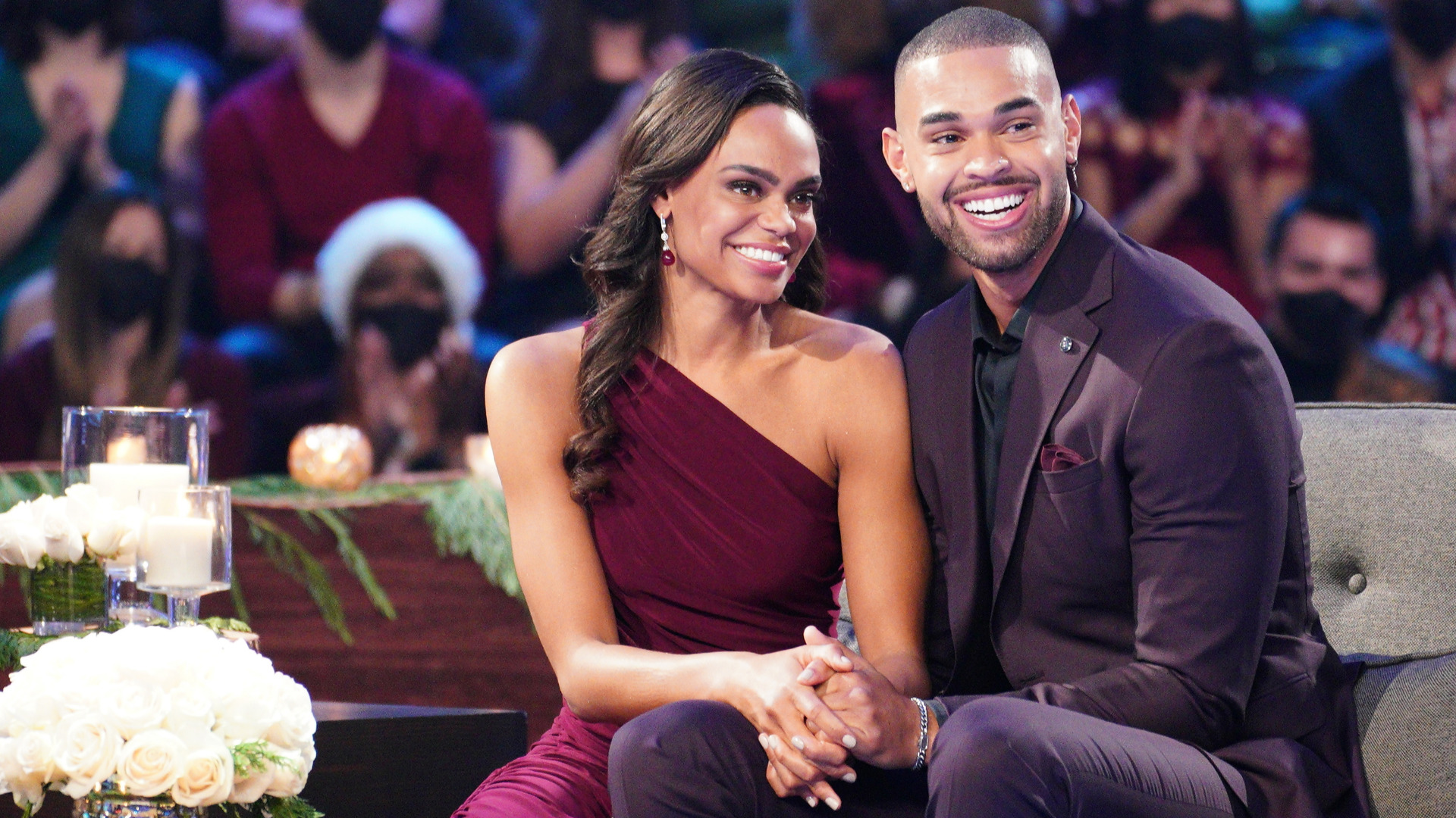 'The Bachelorette' stars Michelle Young and Nayte Olukoya pose on stage in 'After the Final Rose'