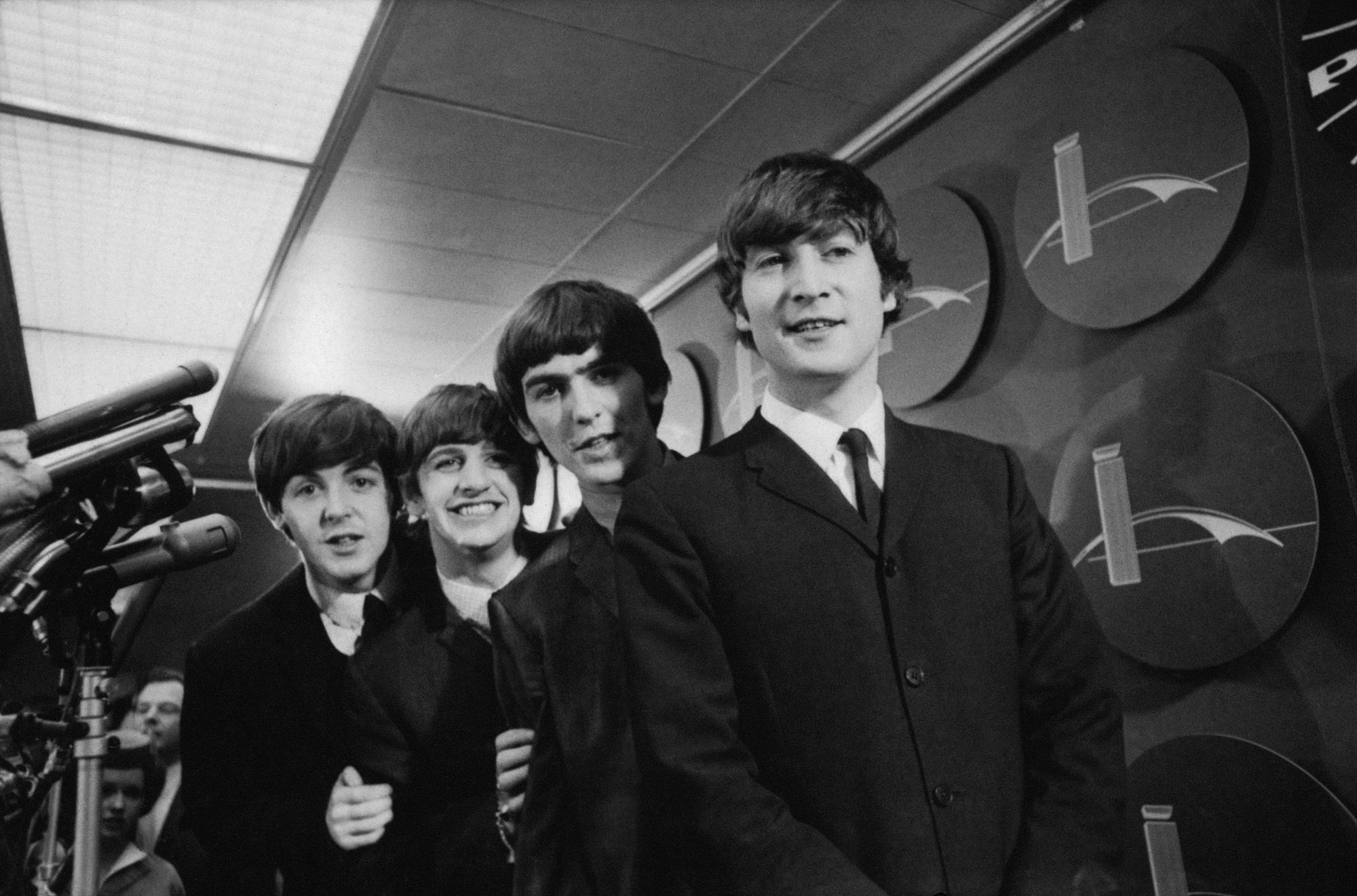 A black-and-white photo of The Beatles in 1964