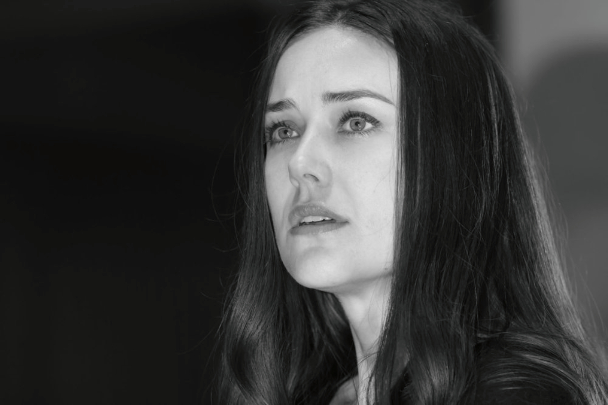 Megan Boone as Liz Keen in The Blacklist in a black and white photo. 