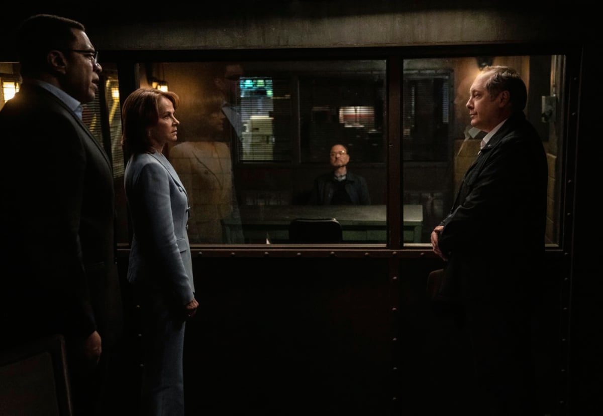 Cooper, Red, and Panabaker in The Blacklist Season 9 finale. The trio stand outside Marvin Gerard's interrogation room. 