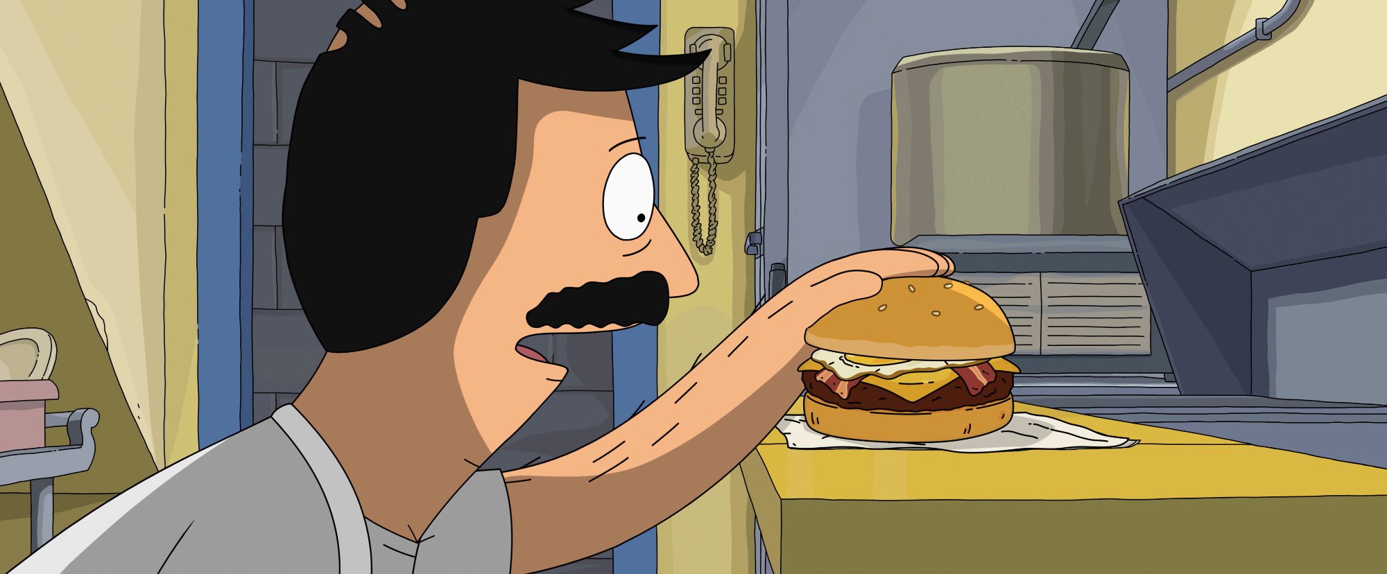 'The Bob's Burgers Movie' Bob Belcher (voiced by H. Jon Benjamin) looking at a burger and resting his hand on it