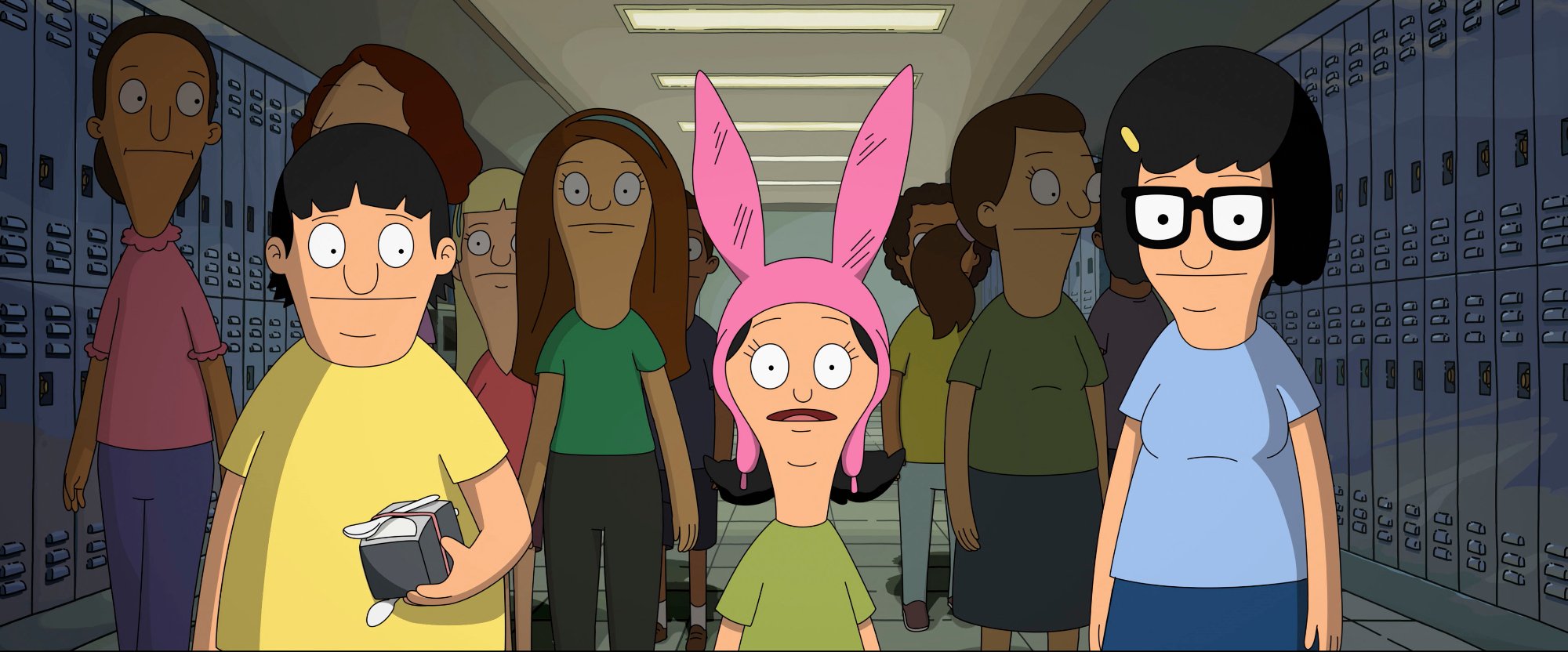 'The Bob's Burgers Movie' Gene Belcher (Eugene Mirman), Louise Belcher (Kristen Schaal), and Tina Belcher (Dan Mintz) walking down a hallway at school with kids standing behind them