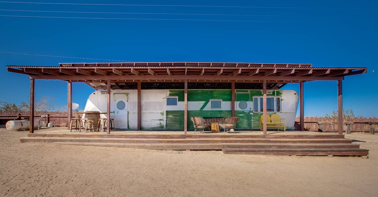 The trailer 'The New World', at Hisckville Palace in Joshua Tree, California. 