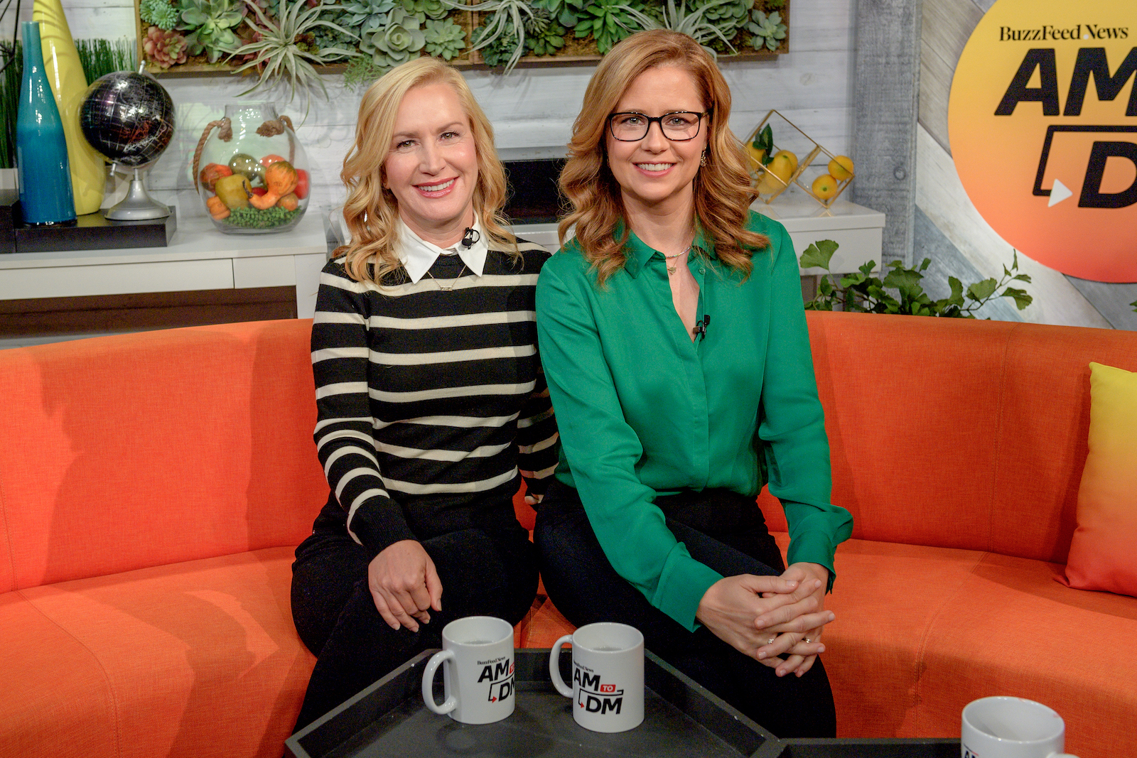 Angela Kinsey and Jenna Fischer from 'The Office' smile for a photo during a live talk show appearance 