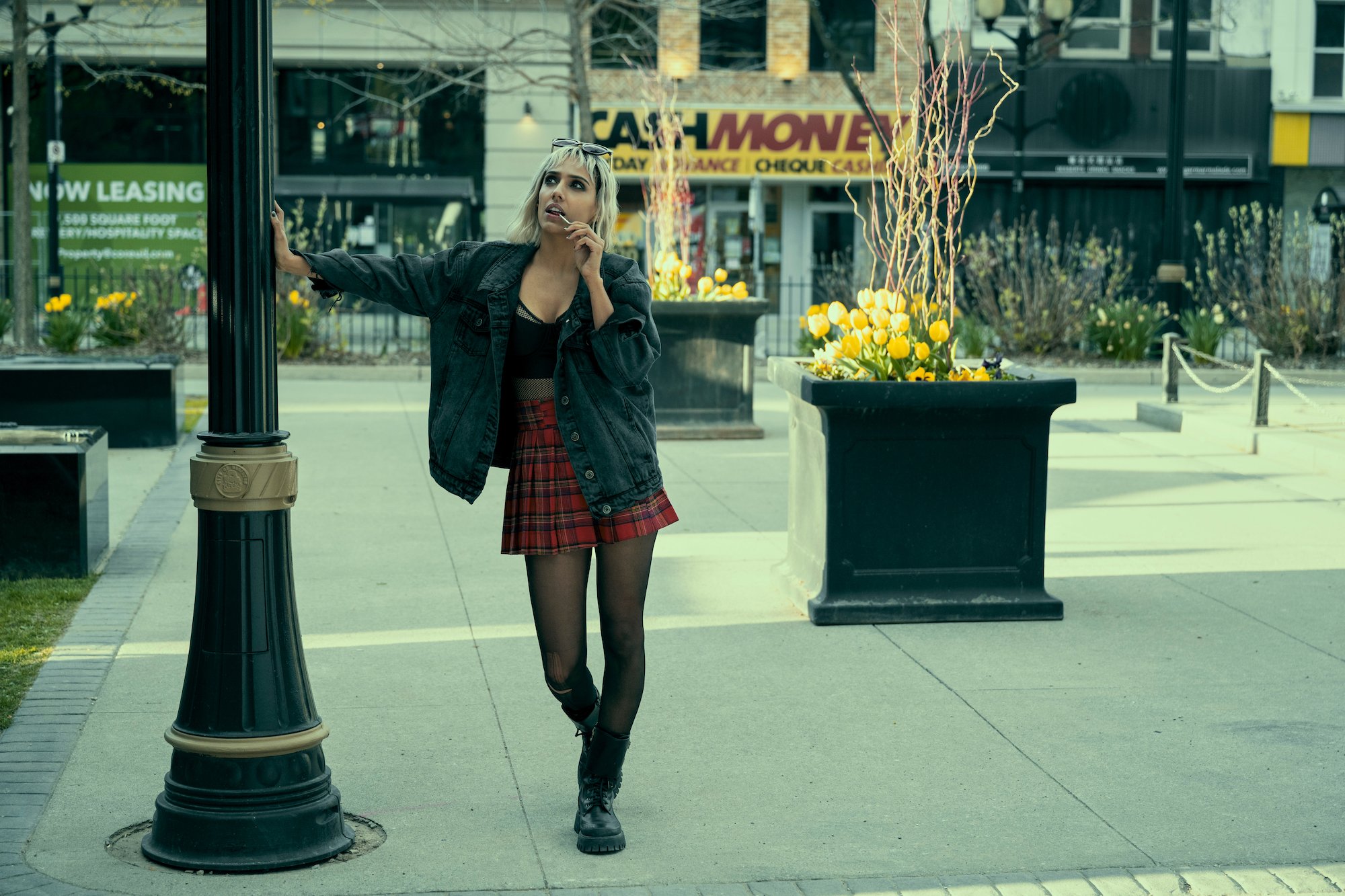 'The Umbrella Academy' Season 3 production still showing Ritu Arya wearing a plaid skirt. 'The Umbrella Academy' might feature Hotel Obsidian, not Hotel Oblivion.