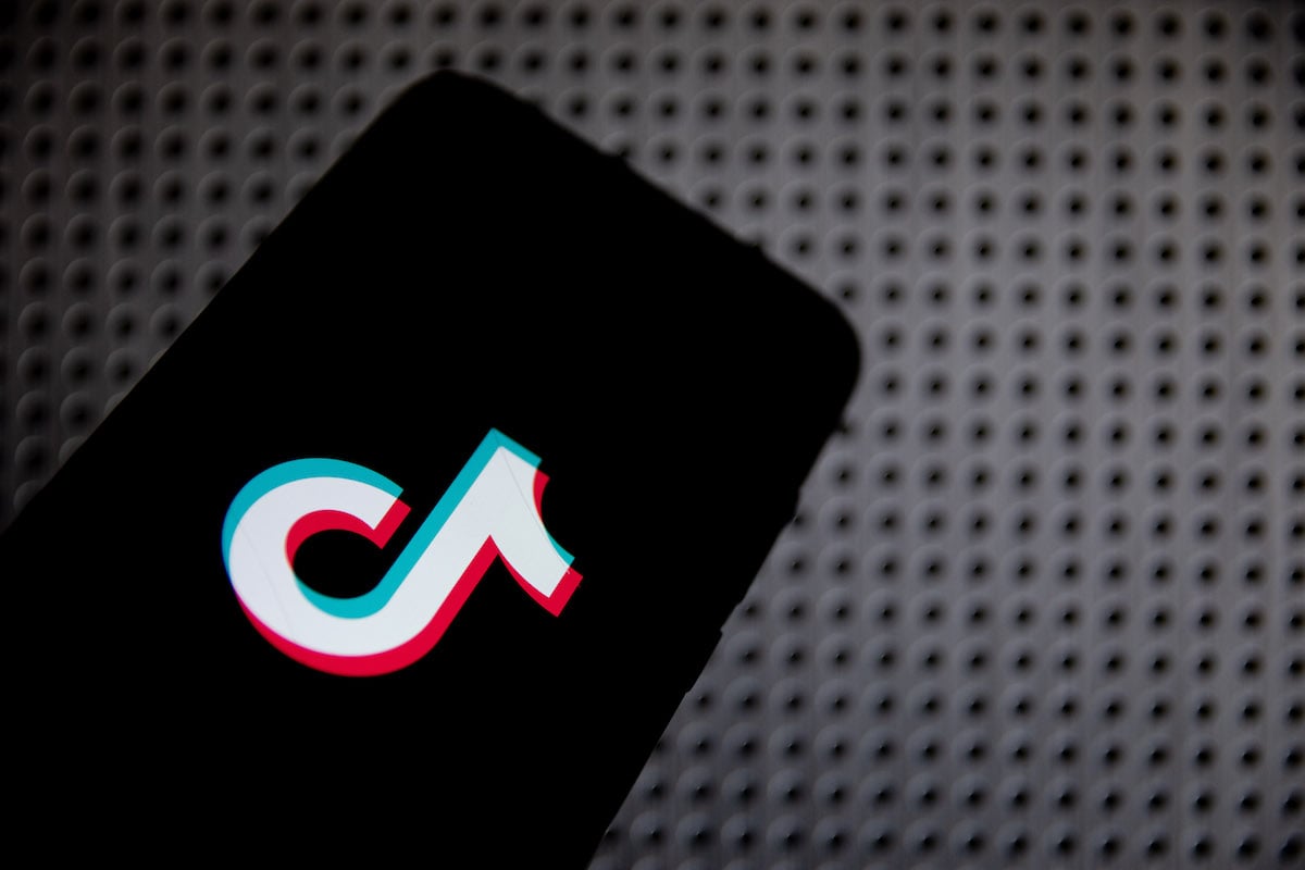In this photo illustration TikTok logo is displayed on a smartphone screen