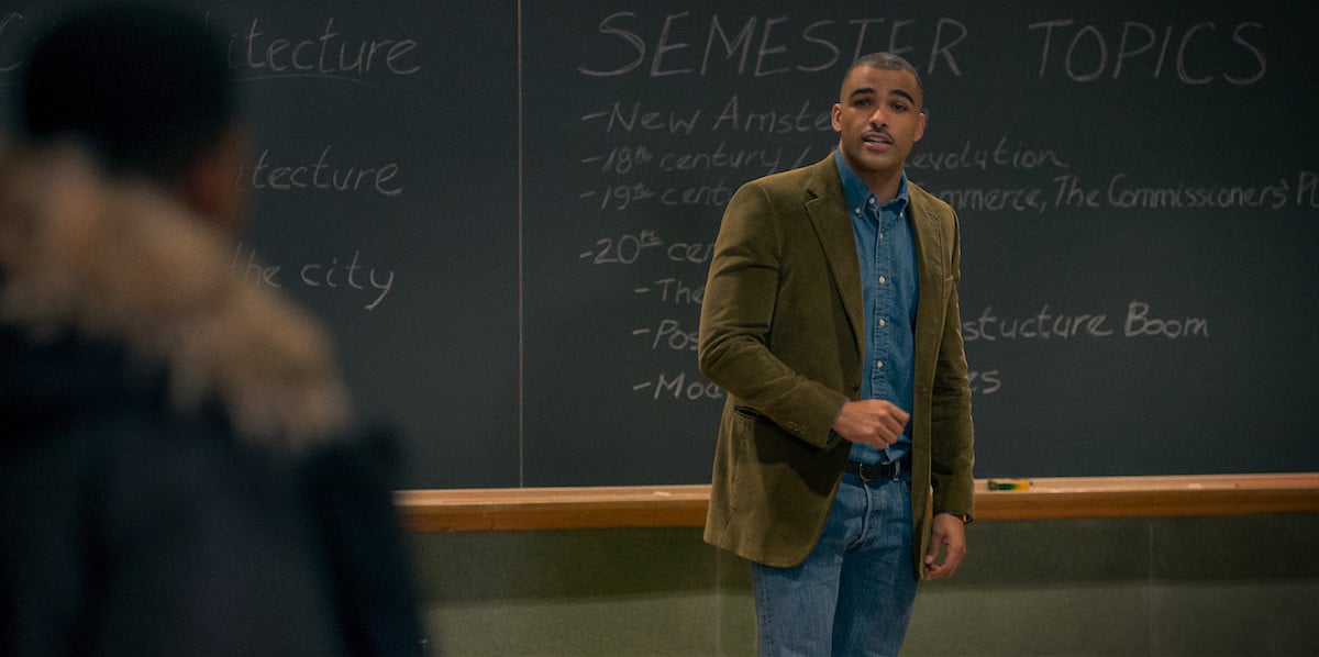 Tony Sandeman as Symphony wearing a blazer and jeans in a classroom in 'Power Book III: Raising Kanan