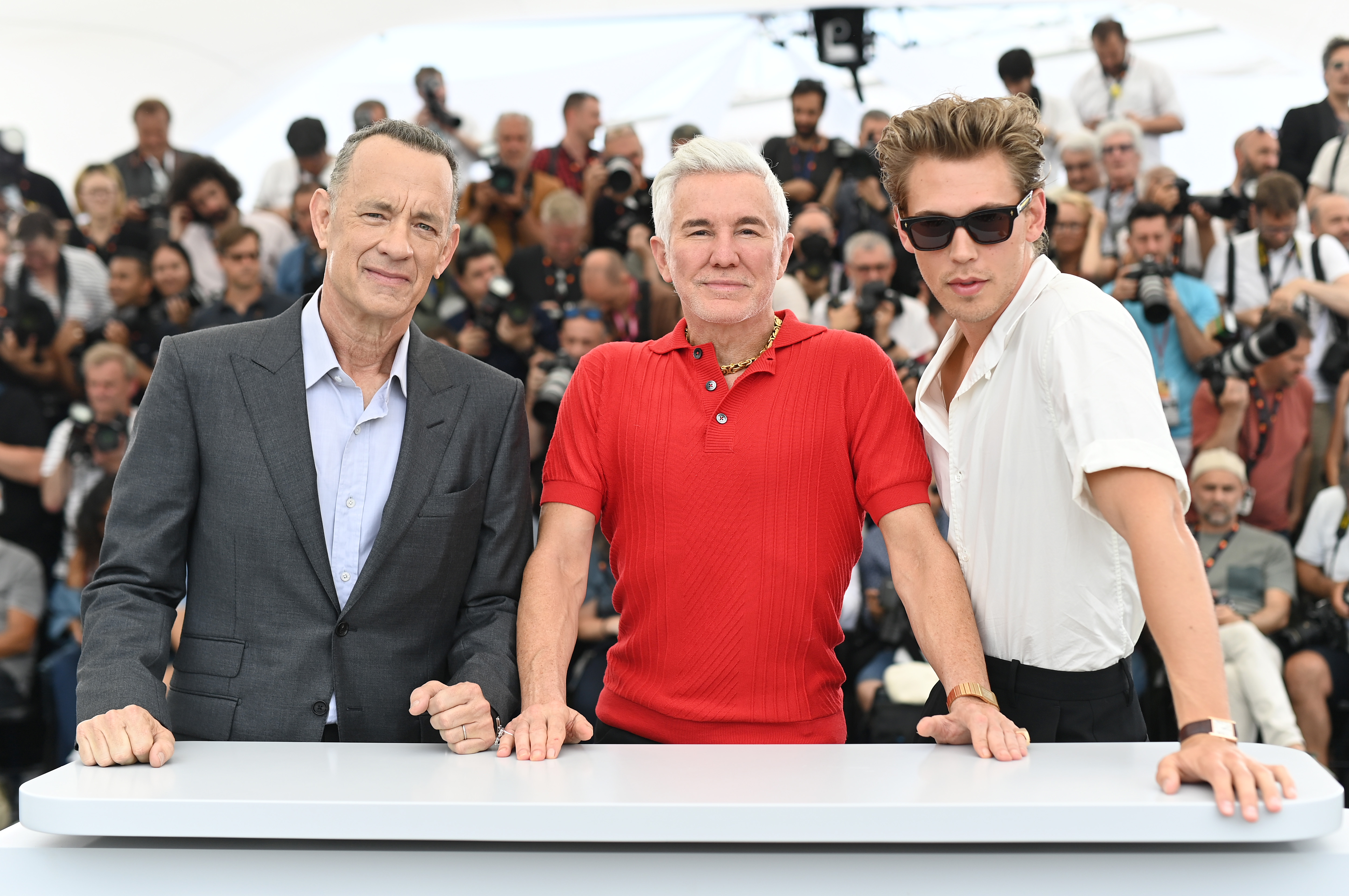Tom Hanks, Baz Luhrmann, and Austin Butler attend the photocall for Elvis at the 75th Cannes film festival