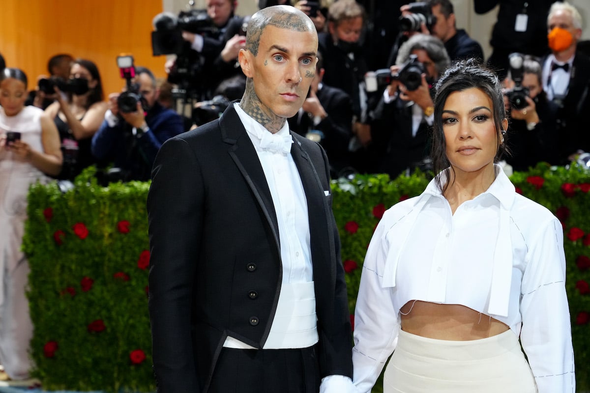 Travis Barker, who said he and Kourtney Kardashian will 'wait' for 'something better' in the future', poses with Kourtney Kardashian 