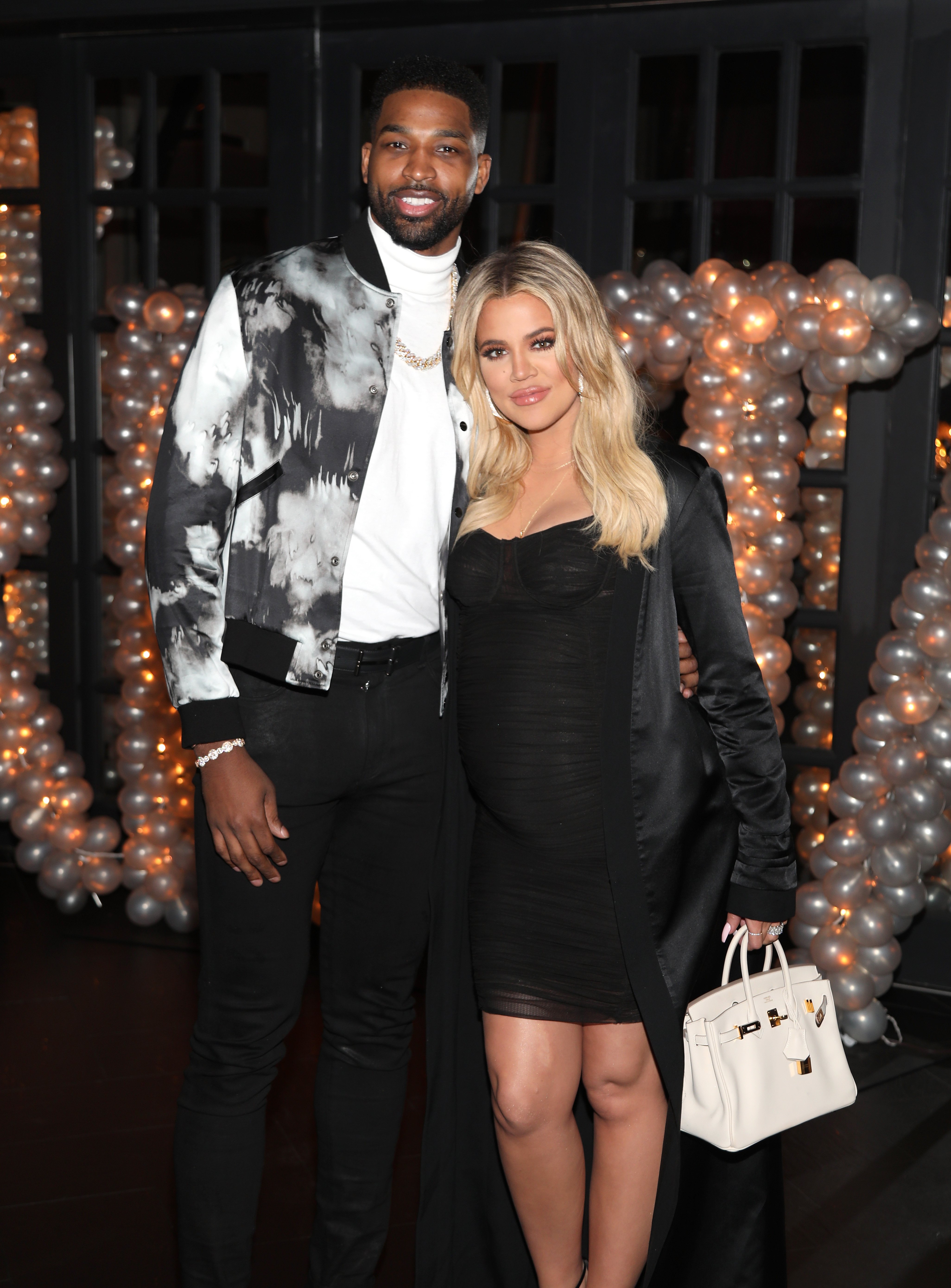 Tristan Thompson and Khloe Kardashian pose for a photo at the NBA player's birthday bash in 2018
