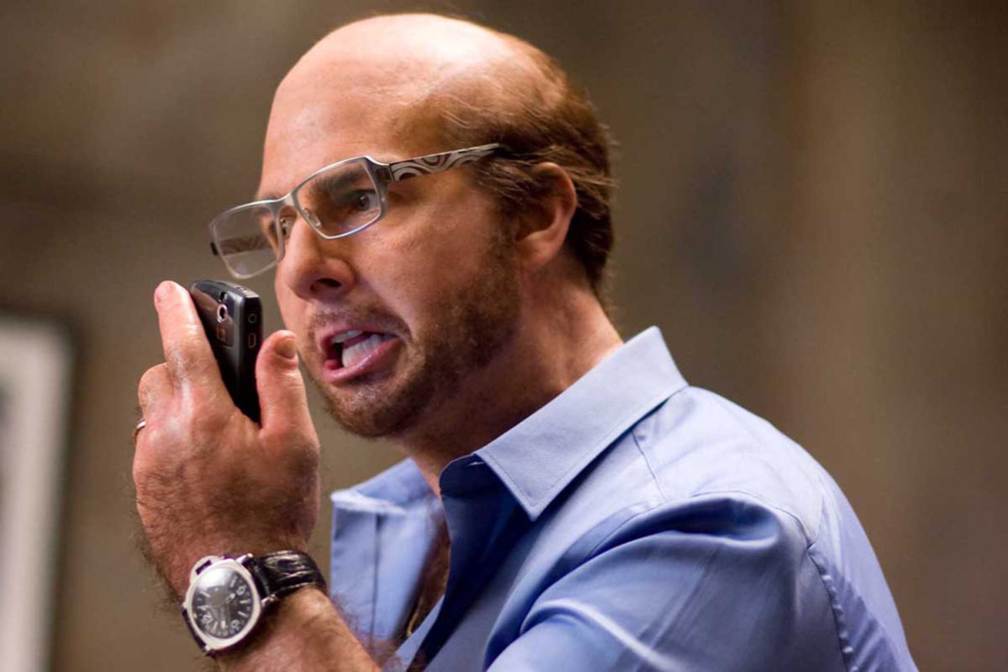 'Tropic Thunder' actor Tom Cruise as Les Grossman yelling into the phone wearing a collared dress shirt