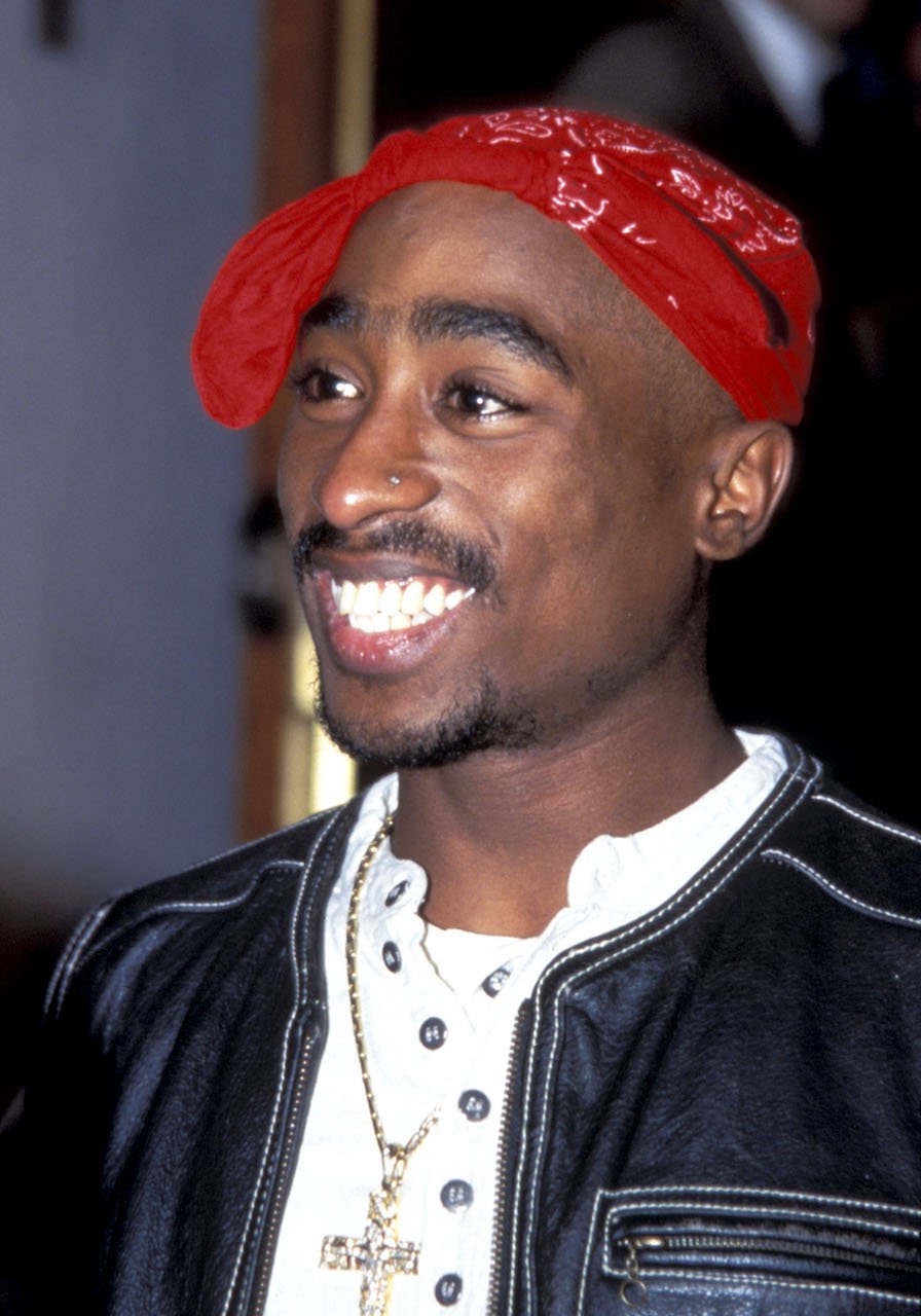 Tupac Shakur smiles for photo - he was planning to open a restaurant before his death