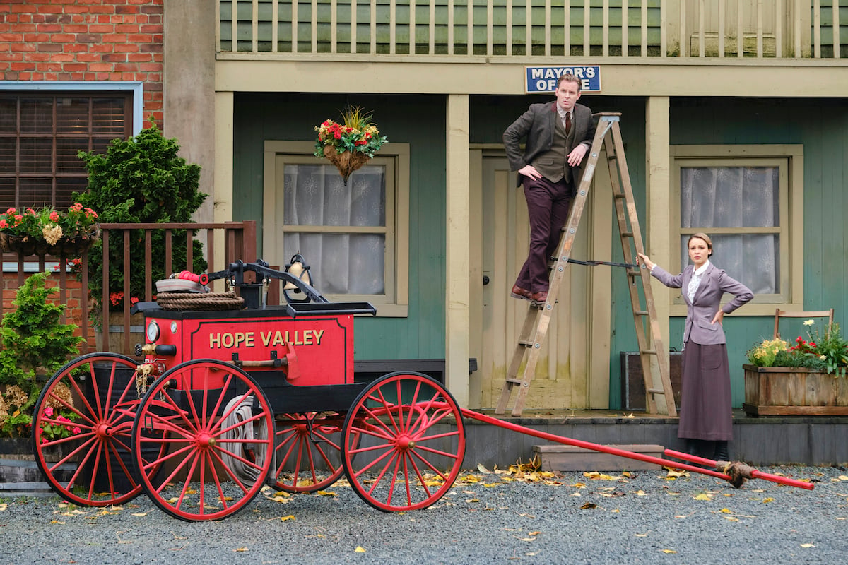 Mike Hickam standing on a ladder with Fiona nearby in the 'When Calls the Heart' Season 9 finale