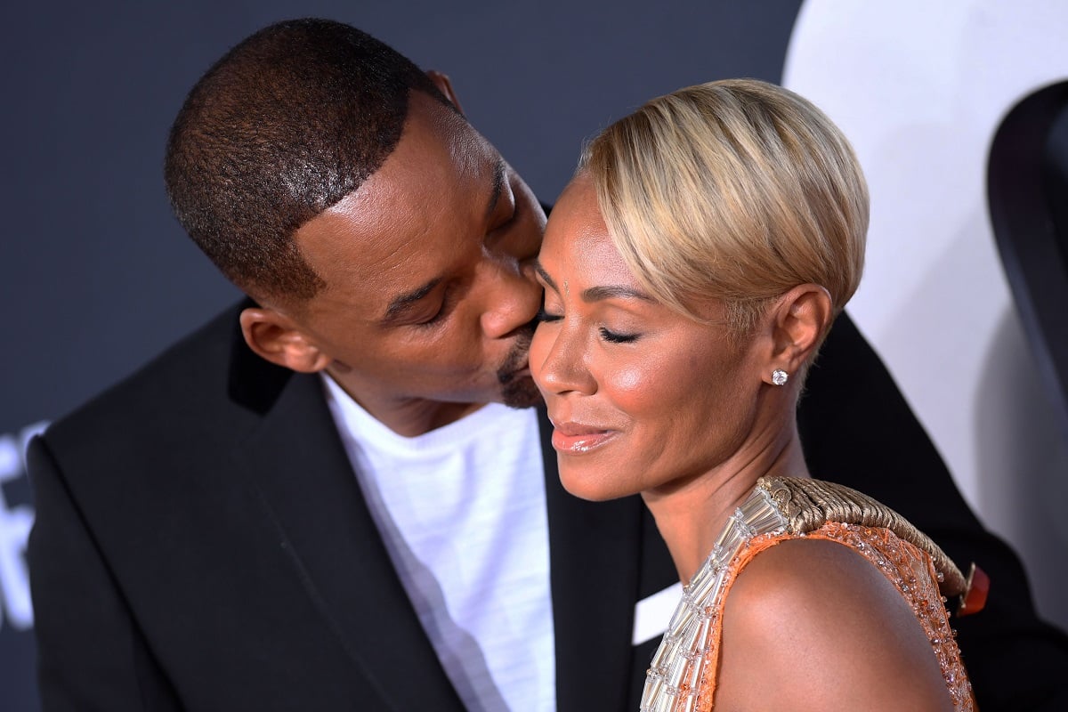 Will Smith kissing Jada Pinkett Smith.