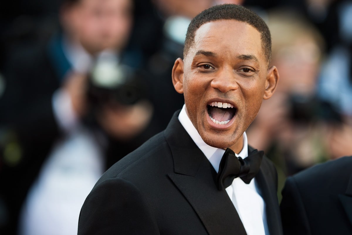 Will Smith smiling while clean shaven and wearing a suit.