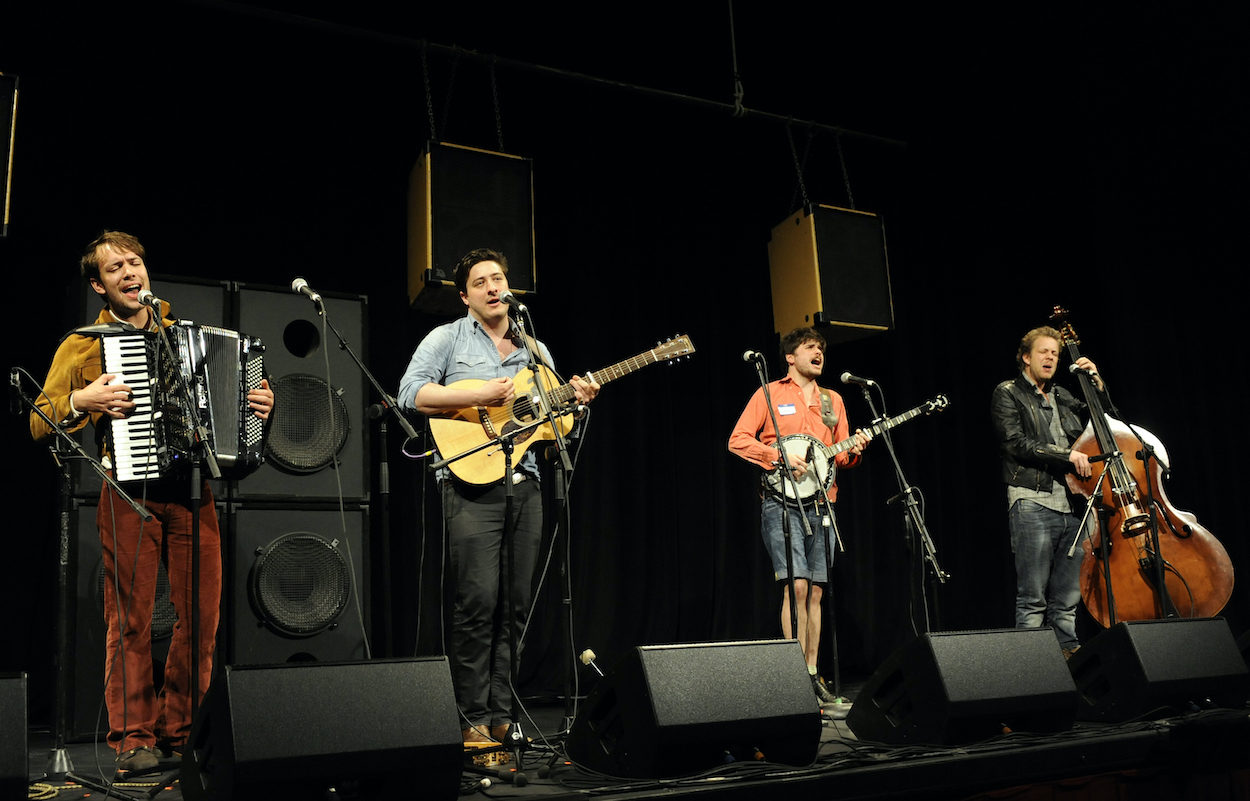 Mumford & Sons -- Ben Lovett, Marcus Mumford, Winston Marshall, and Ted Dwane (left to right) -- perform at SXSW in 2012.