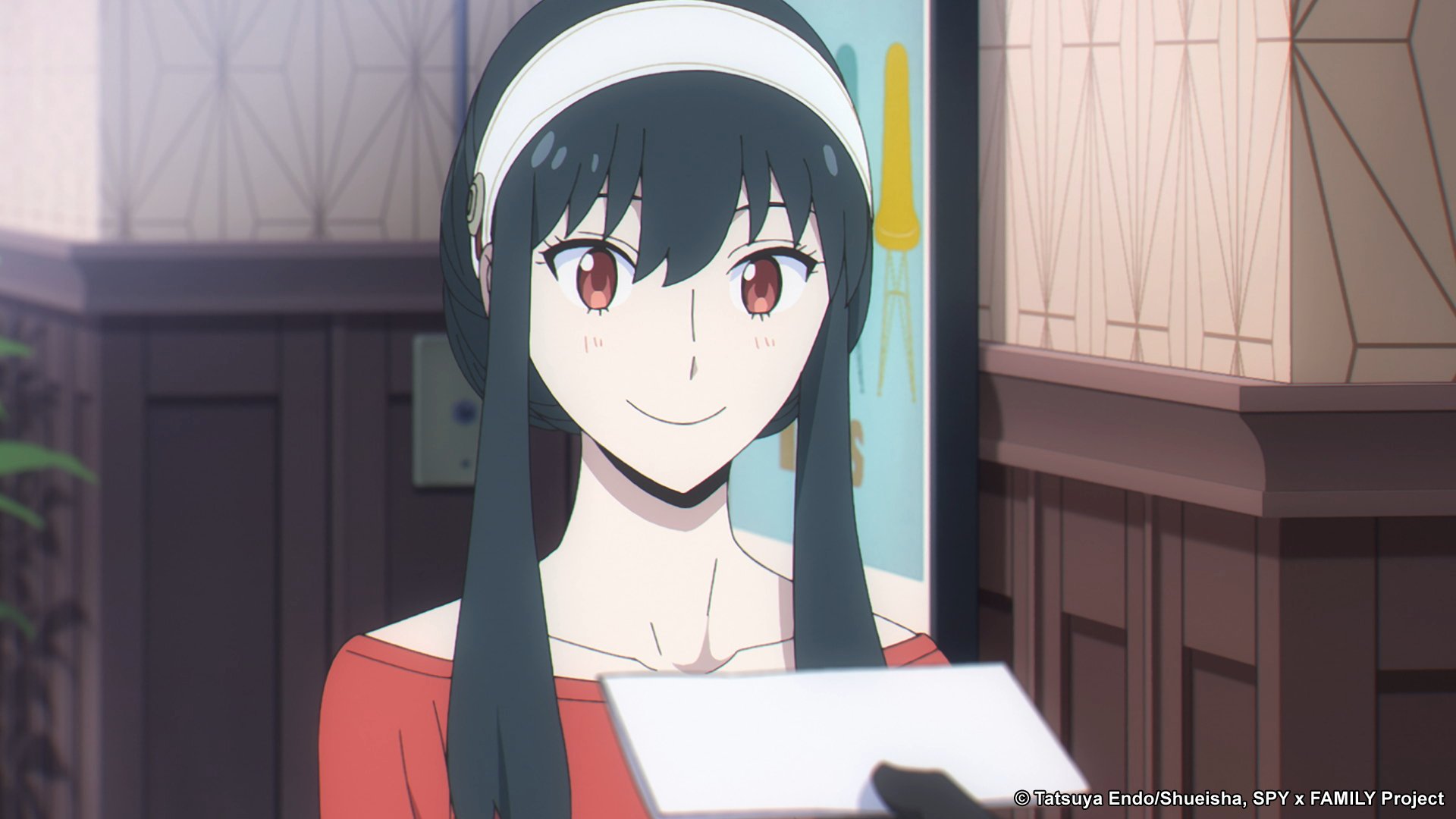 Yor Forger, whose brother will make an appearance on the release date for 'Spy x Family' Episode 8. She's wearing a red sweater, white headband, and holding a piece of paper.